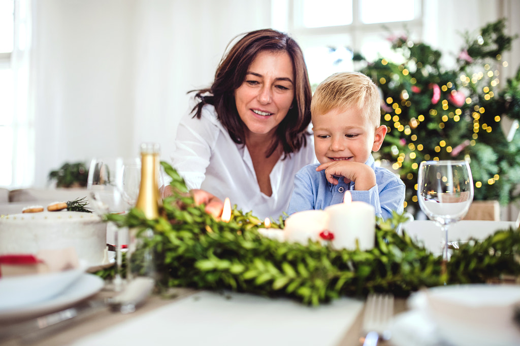 A small boy with grandmother sitting at the table at home at Christmas time. by Jozef Polc on 500px.com