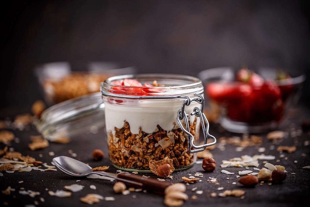 Glass jar of oat granola by Cseh Ioan on 500px.com