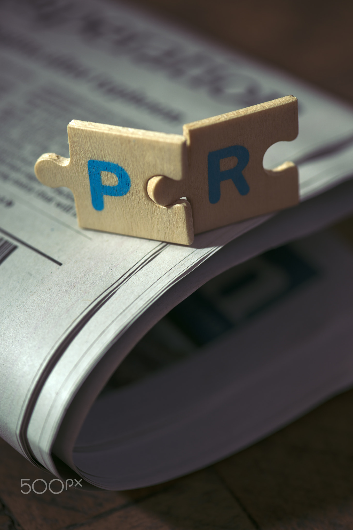 PR letters on newspaper