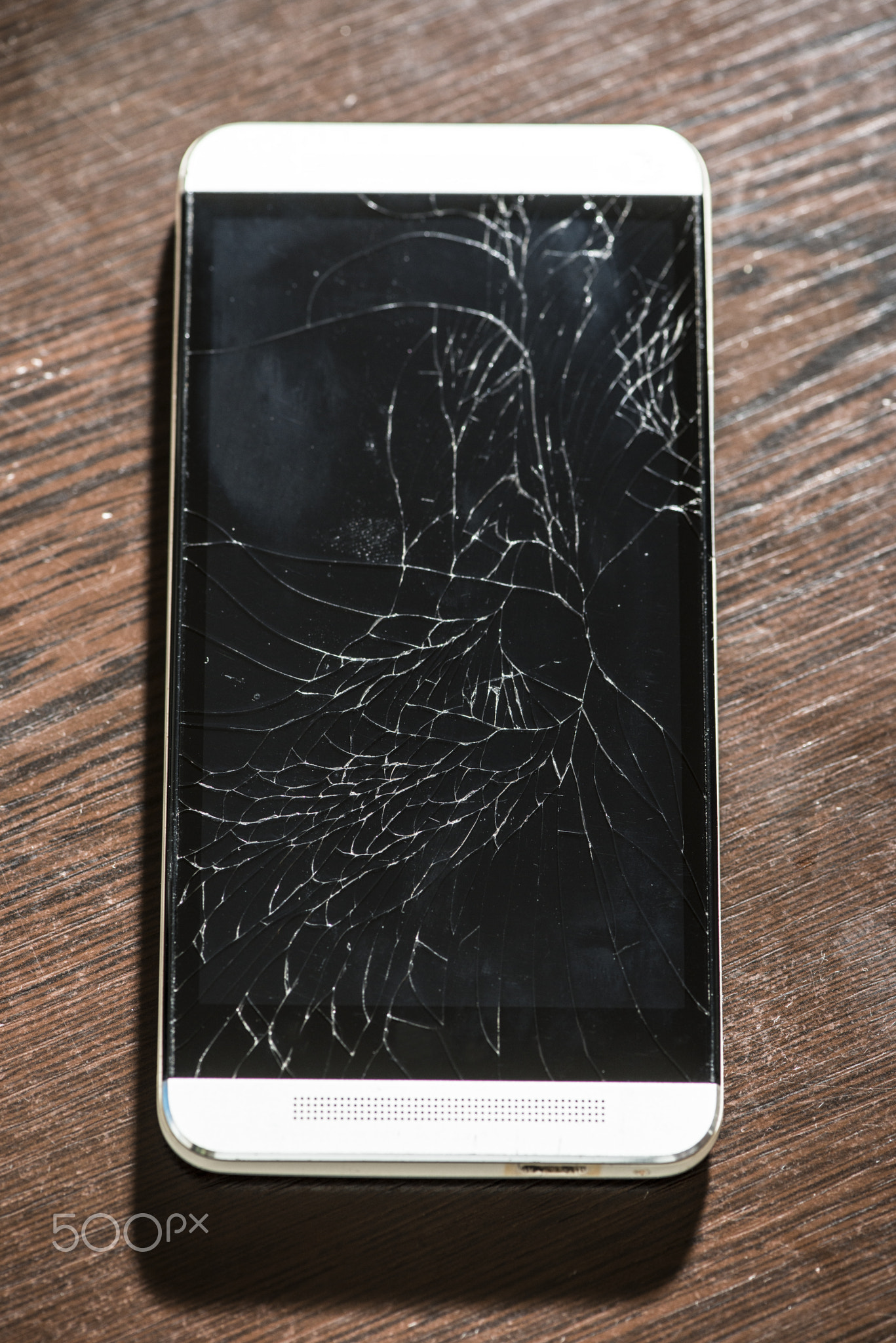 Cracked smart phone screen. Broken phone display