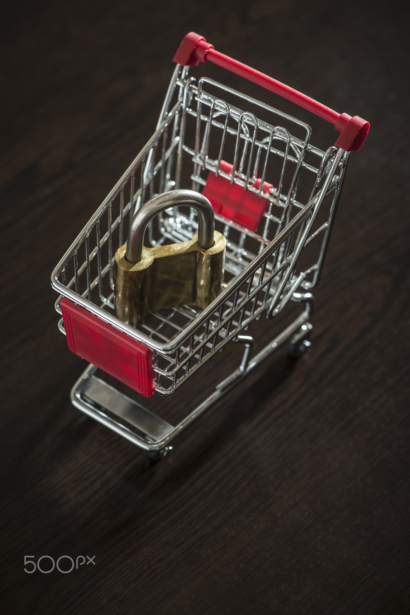 Shopping cart and padlock. Small shopping cart