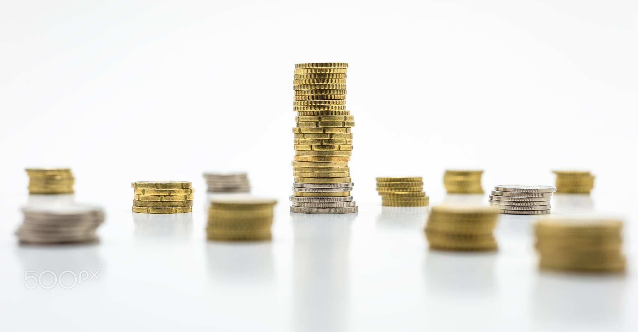 Stack of gold coins, isolated on white background.
