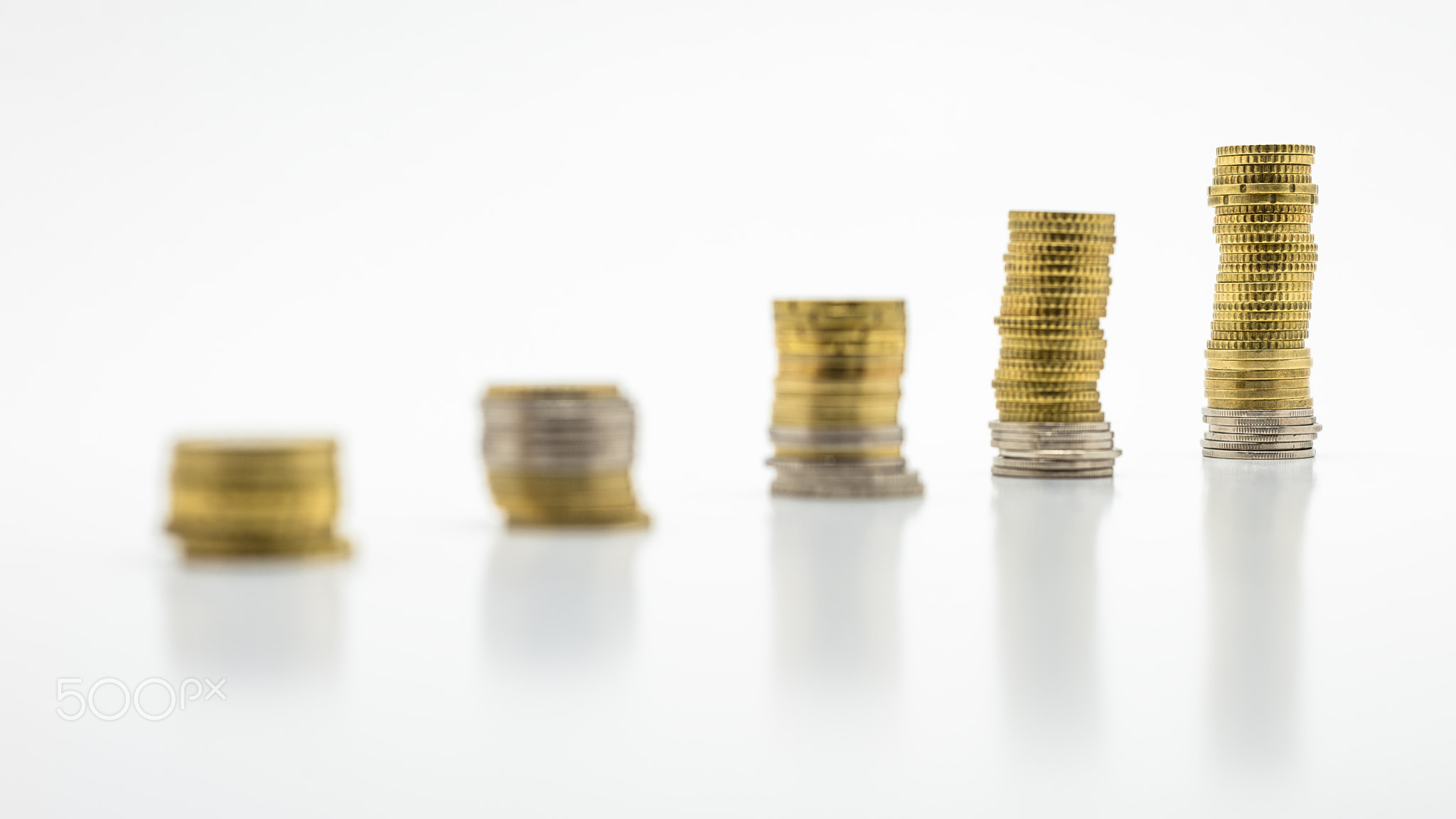 Stack of gold coins, isolated on white background.