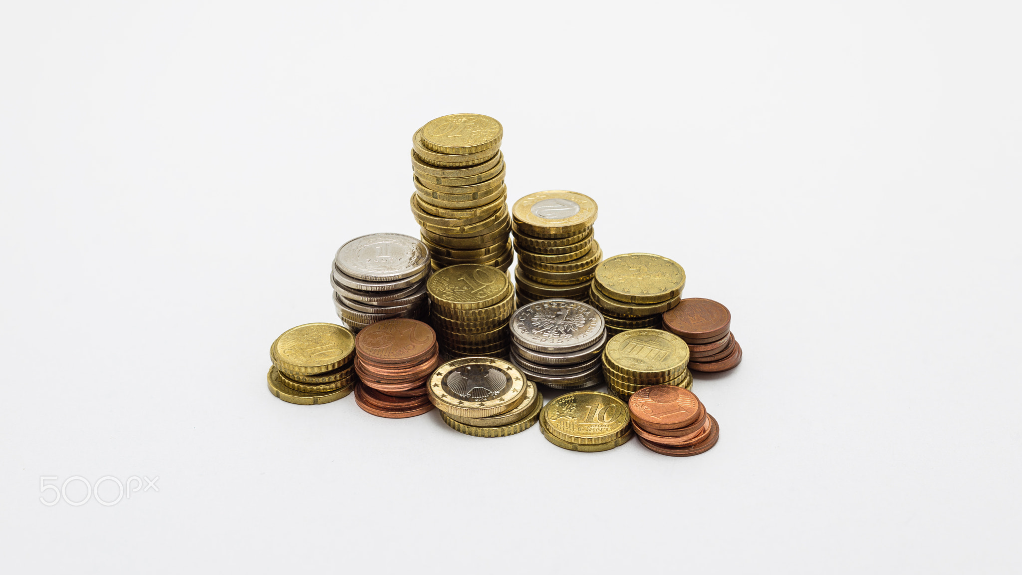 Stack of gold and silver coins isolated on white b