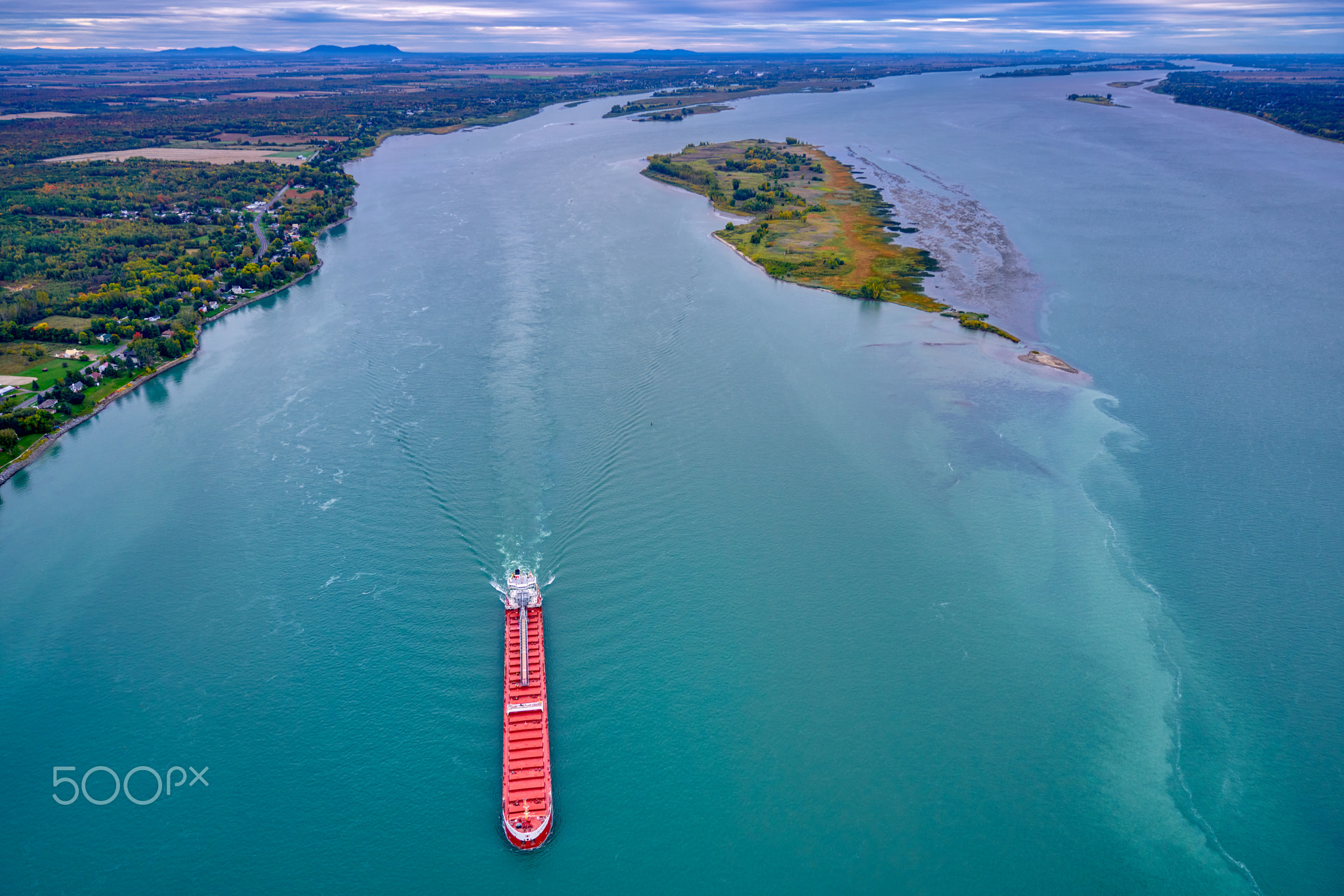 Aerial view of a red ship on the Saint-Lawrence