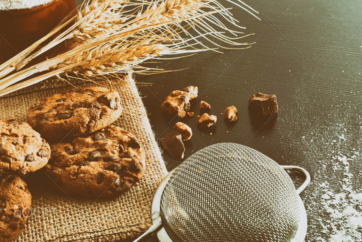 Composition biscuits with chocolate on black table vintage eleva