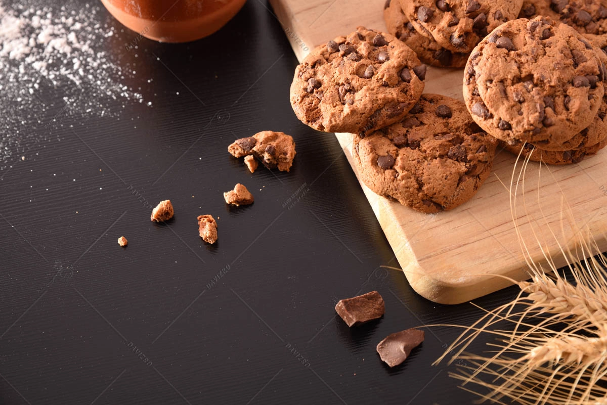 Biscuits with chocolate chips on black table elevated homemade