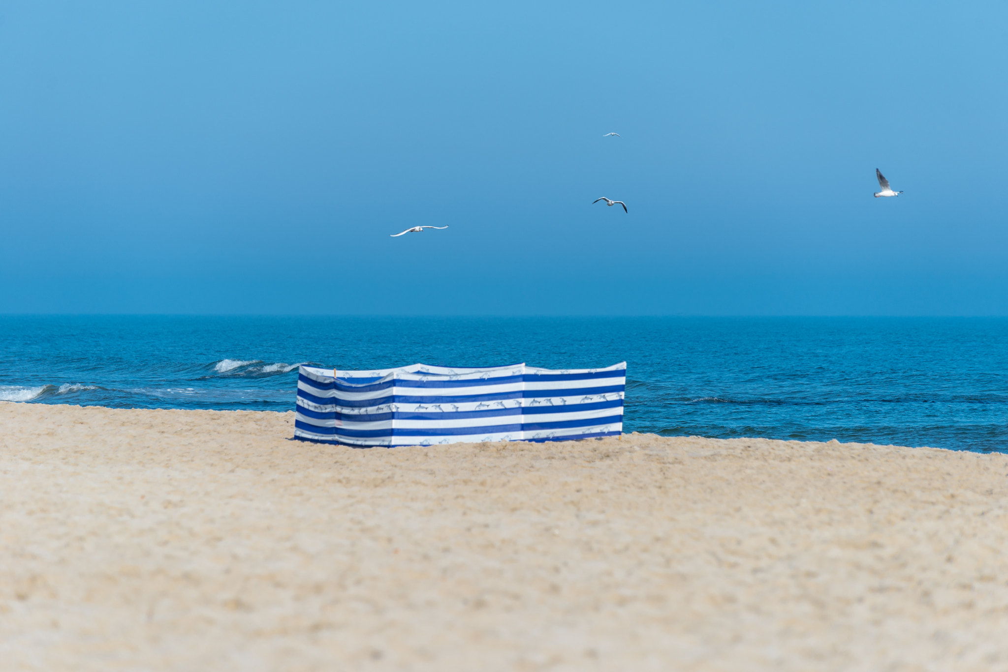 Beach screen on the Polish beach on a sunny summer