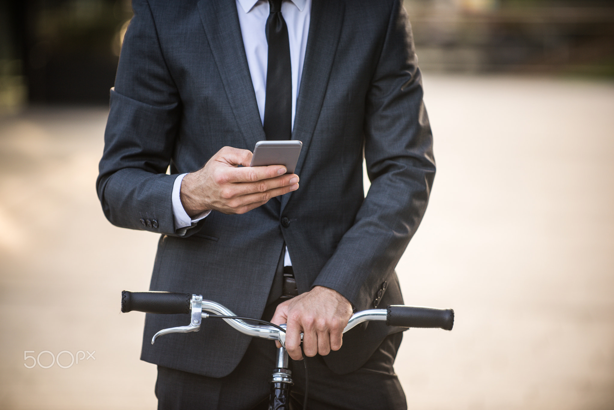 Businessman cycling outdoors