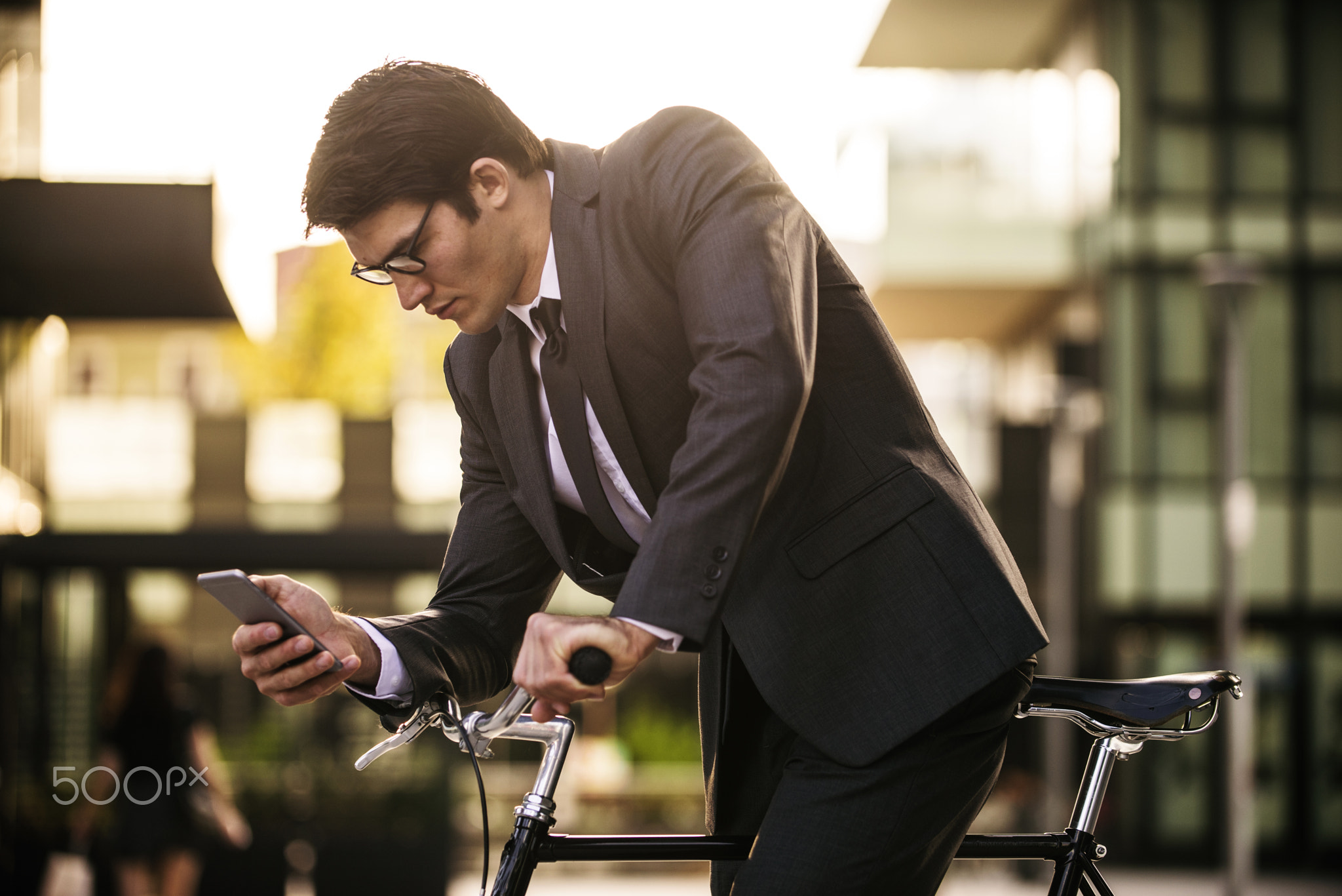 Businessman cycling outdoors