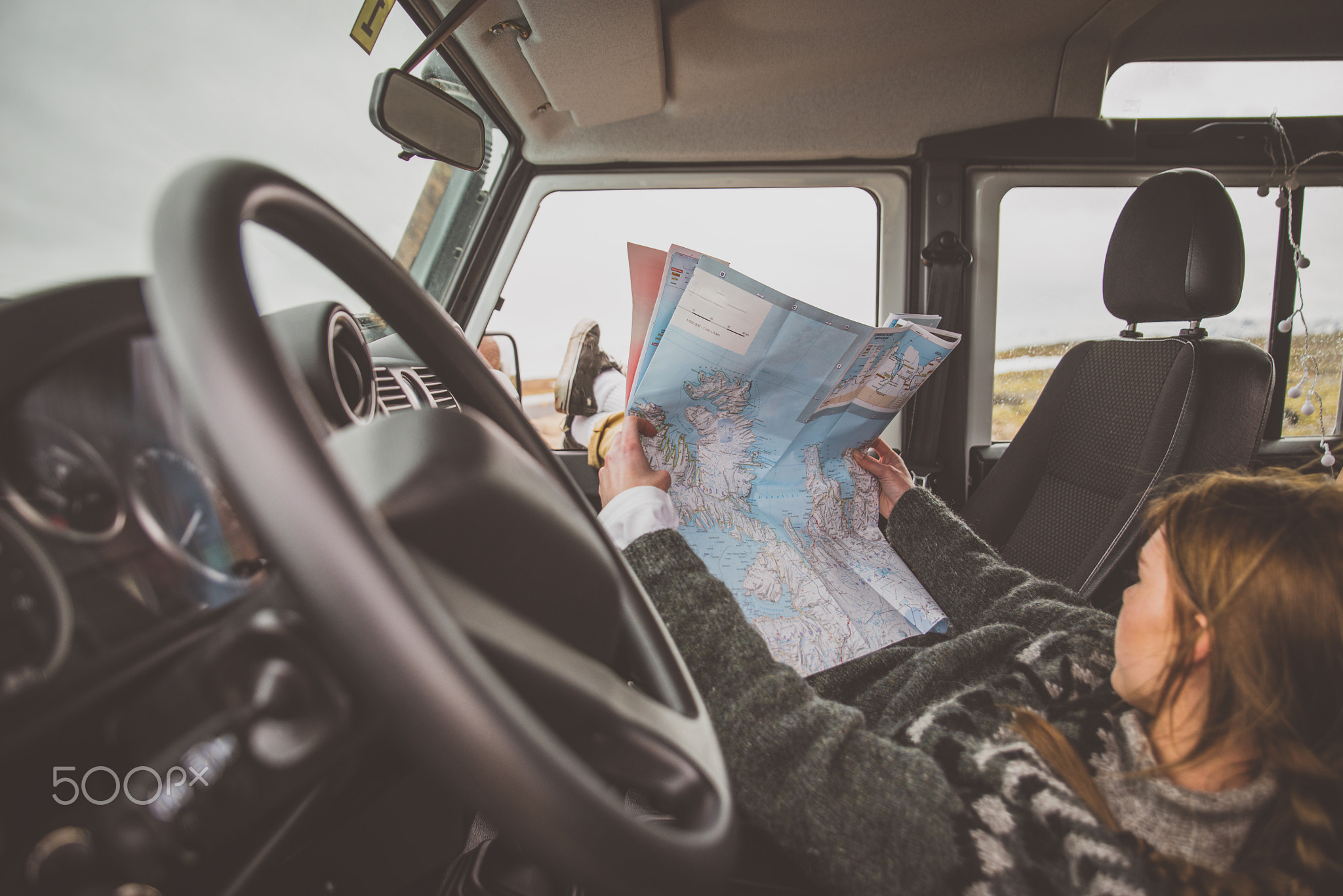 Woman looking at the map during the journey