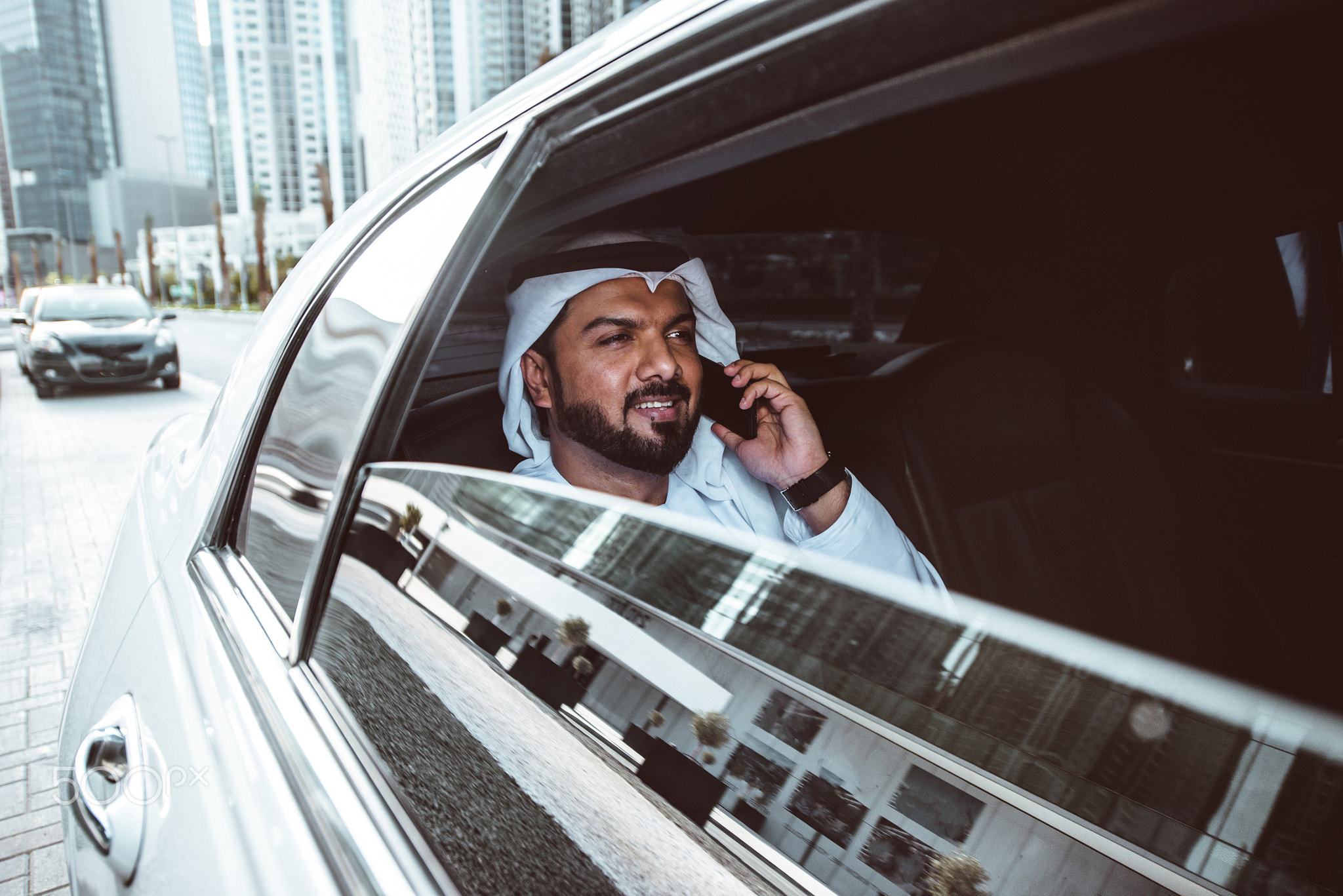 Arabic businessman looking at the skyline in Dubai