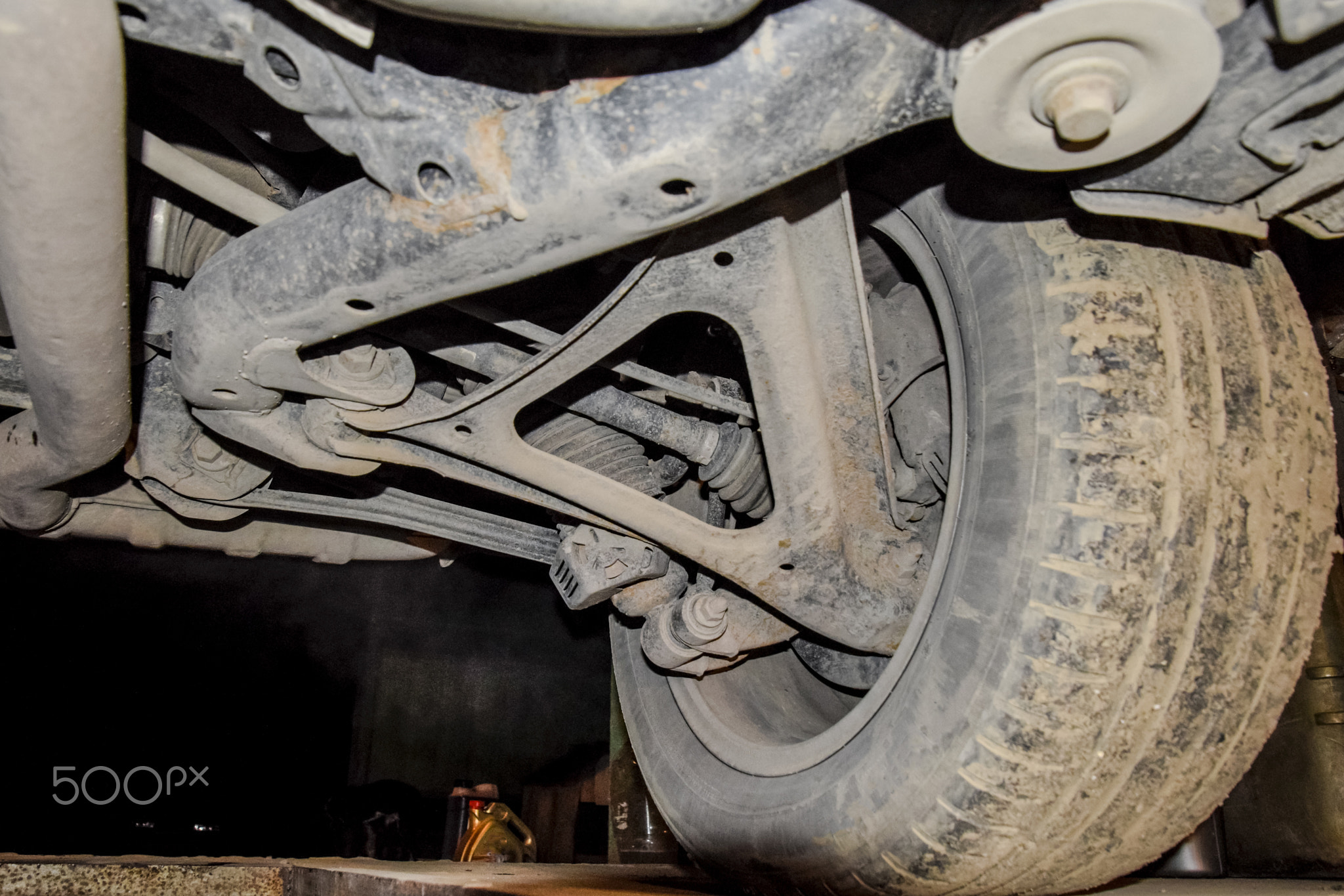 Rear wheel of the car with the elements of the suspension system. Car service