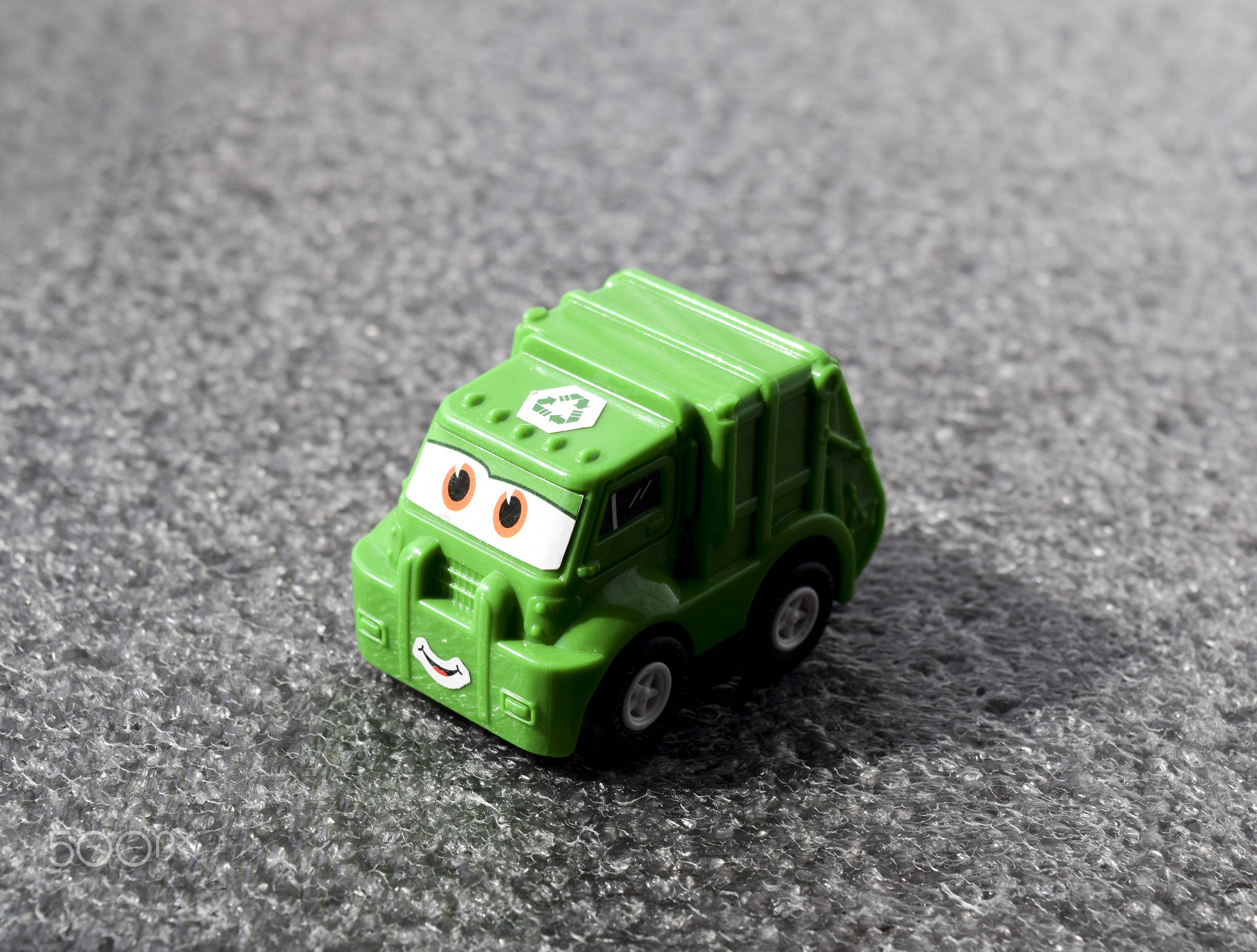 Toy Plastic car is green.