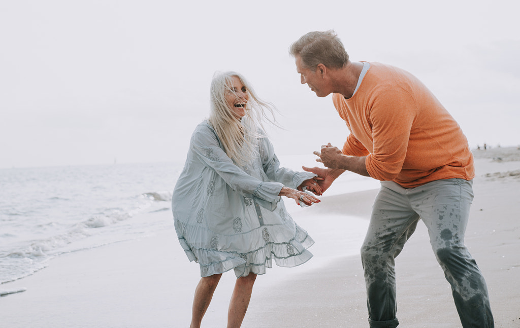 Happy senior couple spending time at the beach. Concepts about l by Cristian Negroni on 500px.com