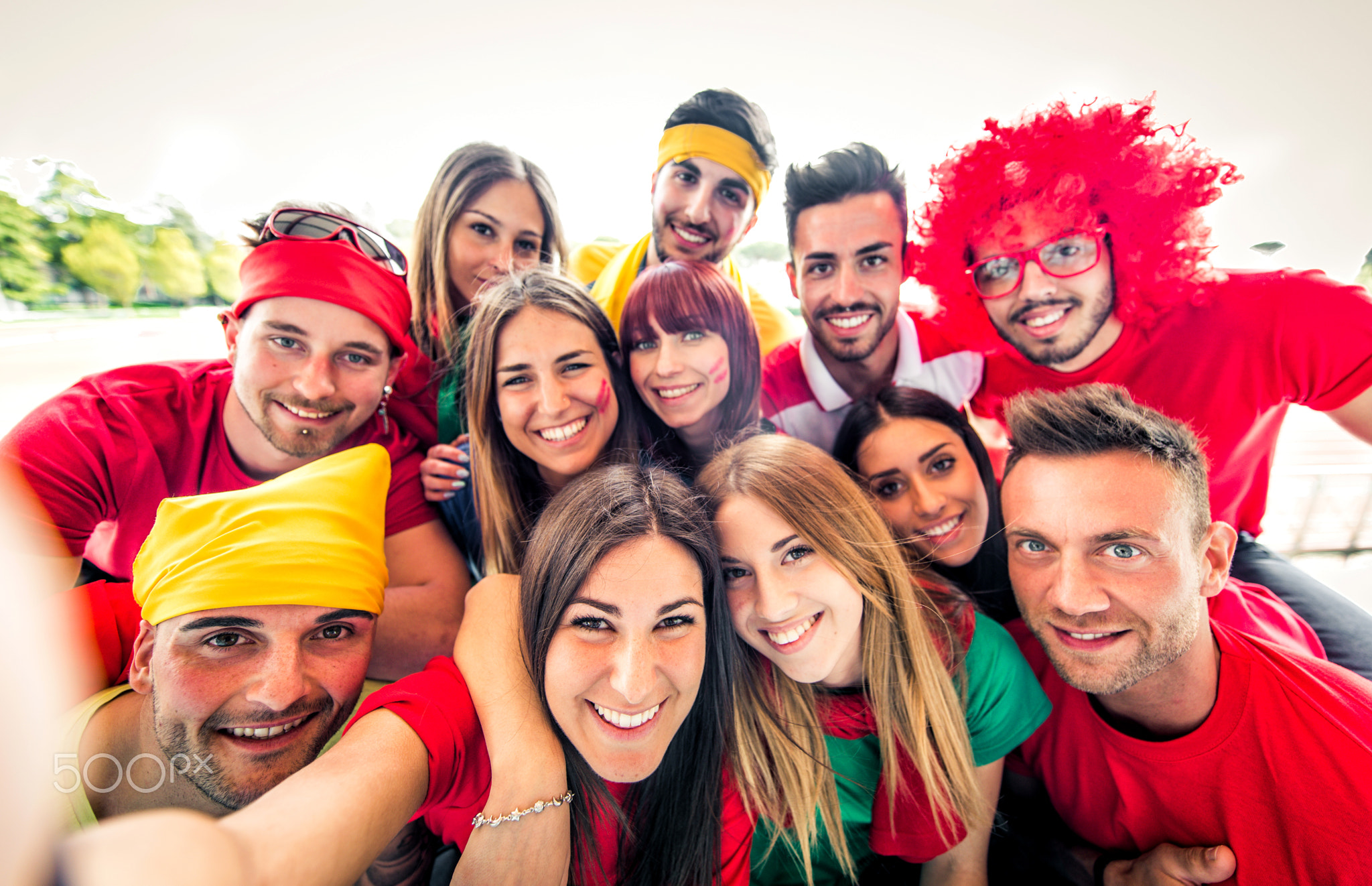 Football fans taking selfie in a stadium