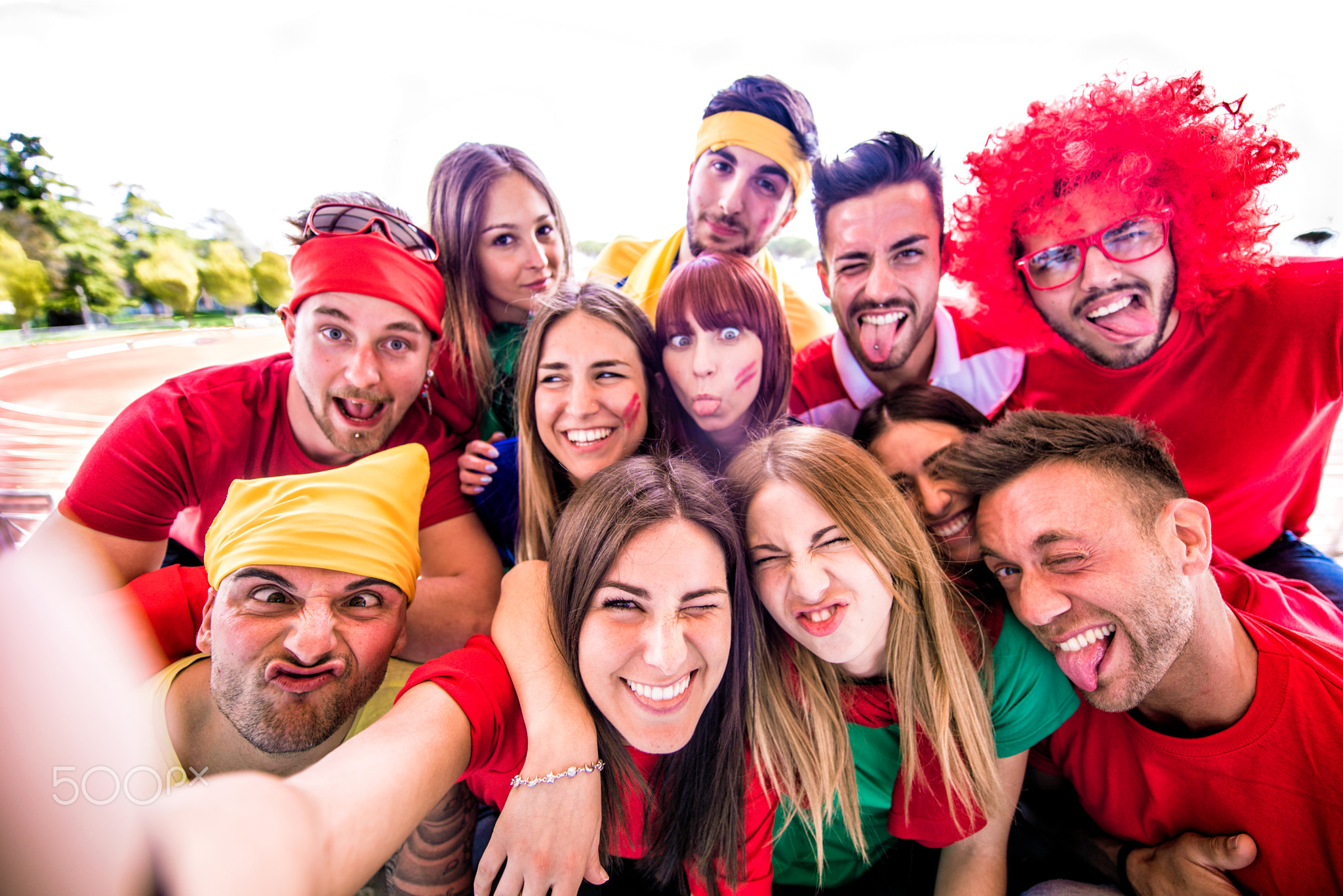 Football fans taking selfie in a stadium