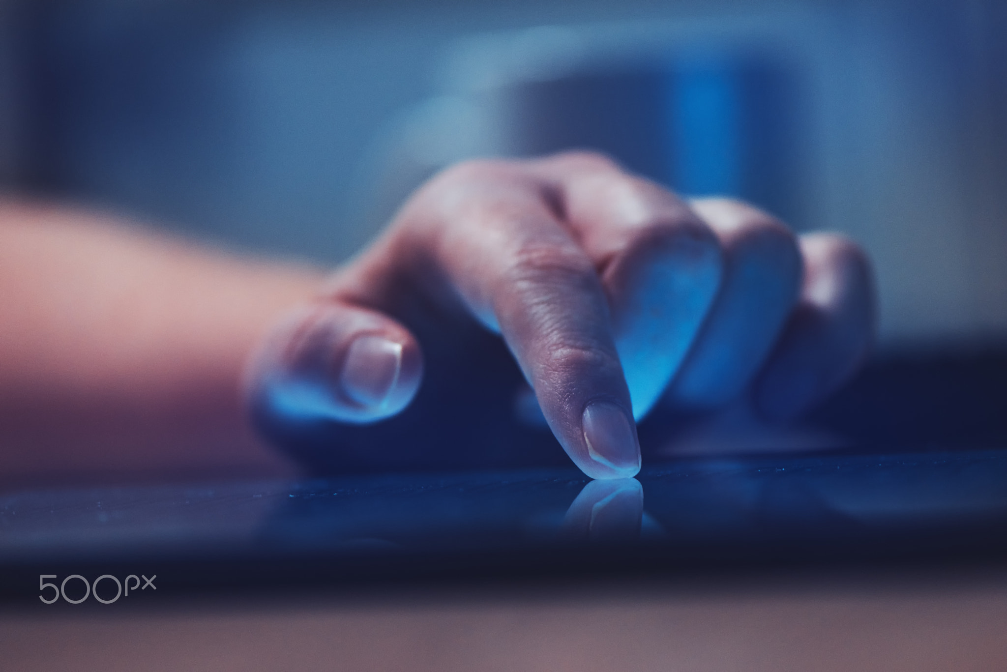 Woman reading online news on digital tablet