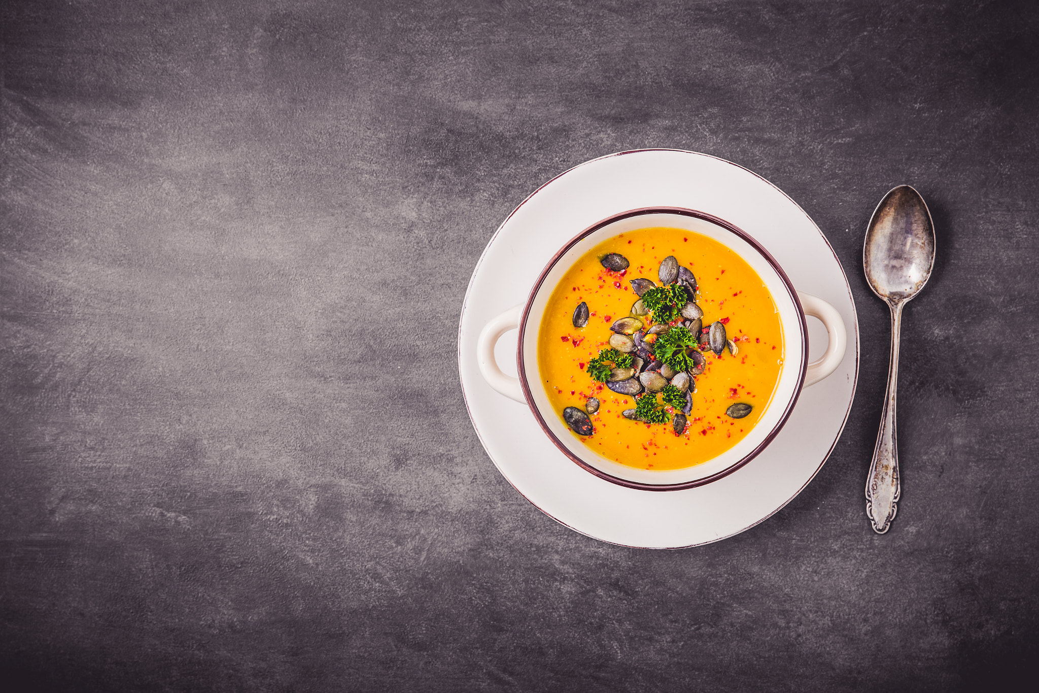 Pumpkin soup with pumpkin seeds and chili peppers