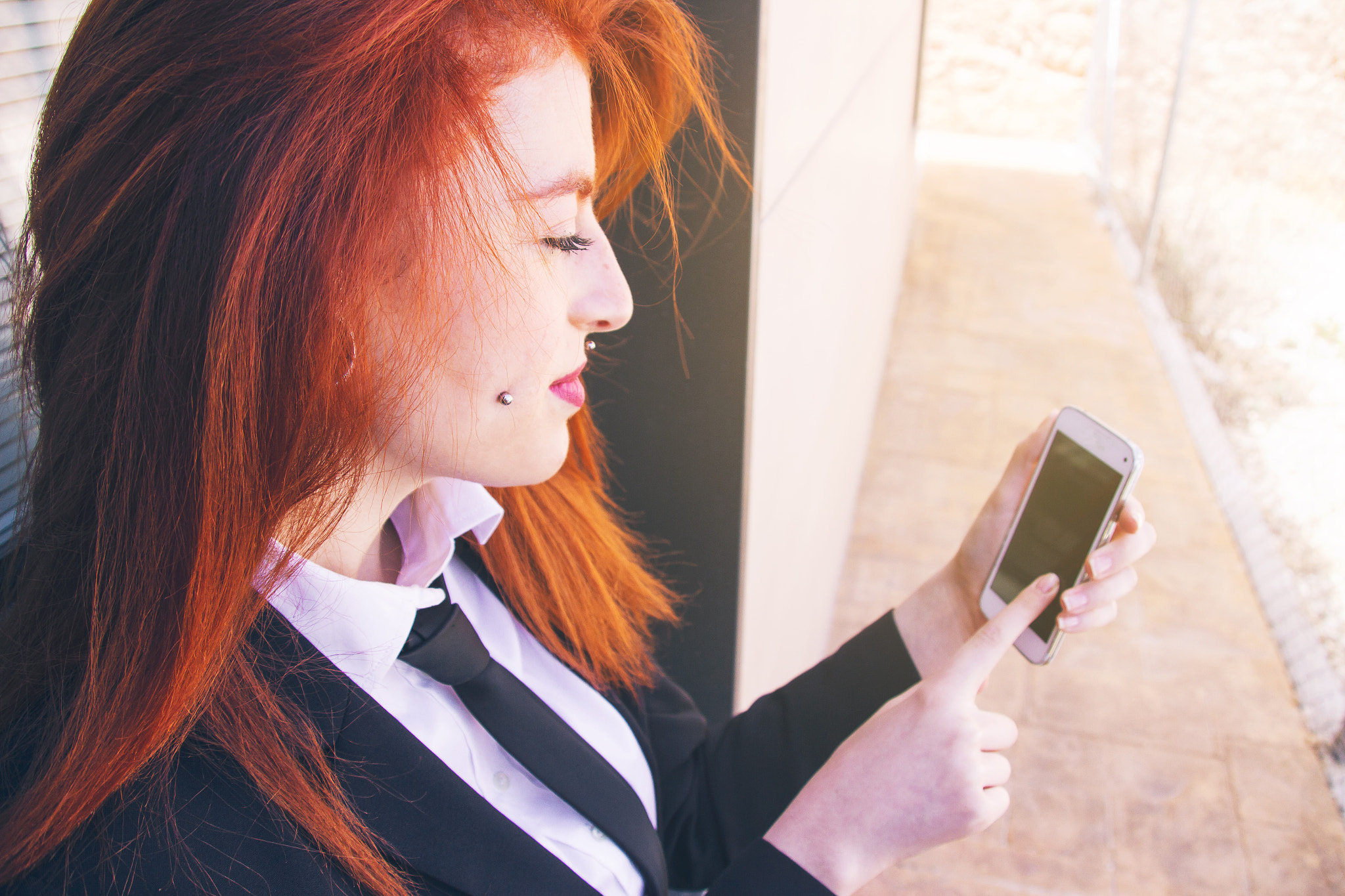 Redhead woman in a working day at office
