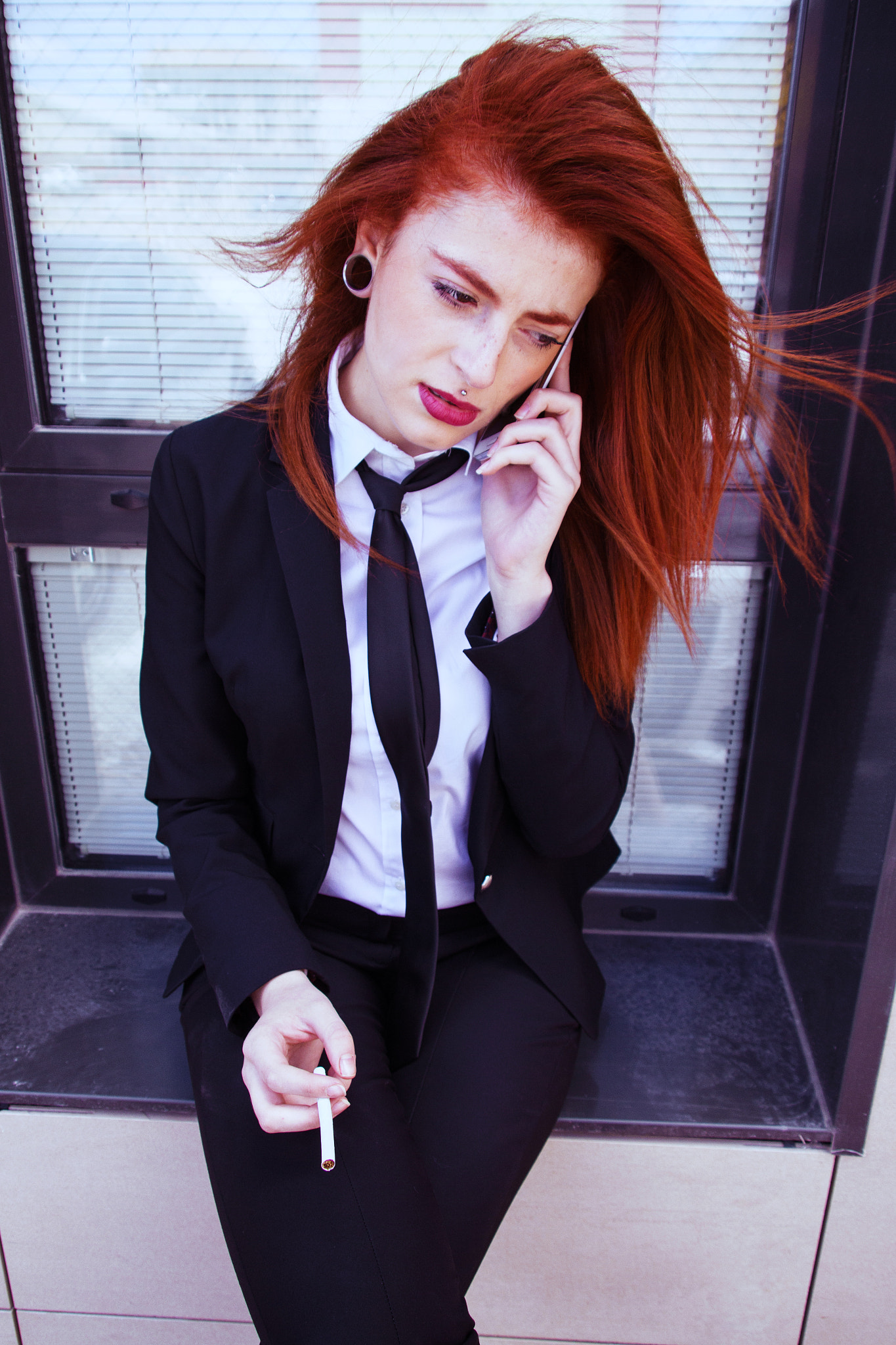 Redhead woman in a working day at office