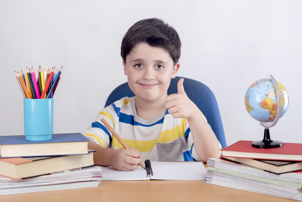 Smiling boy studying by Esther Moreno on 500px.com