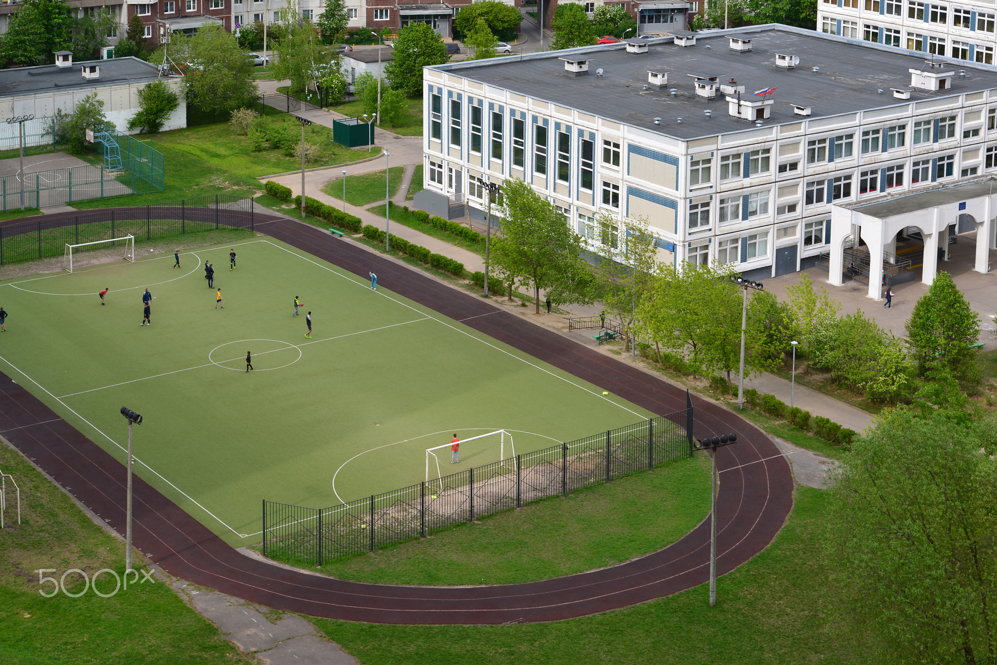 Moscow, Russia -May 15. 2018. City landscape with school and football field