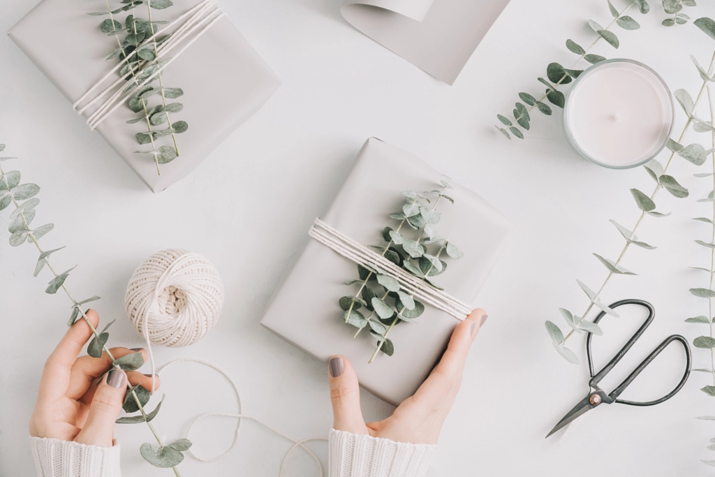 Girl's hands hold a gift box with minimalist style wrapping design. The concept of Christmas and... by Edalin Photography on 500px.com