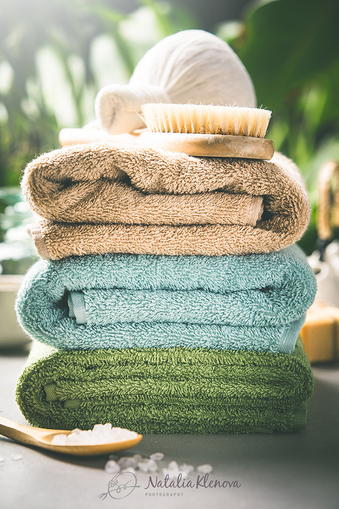 Towels on tropical leaves background by Natalia Klenova on 500px.com