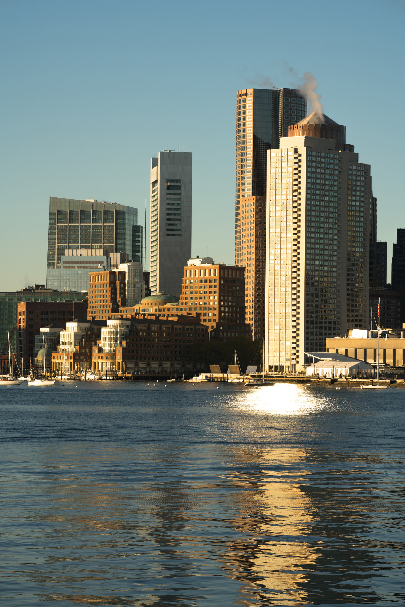 Sunrise on the architecture and waterfront of the urban city sky