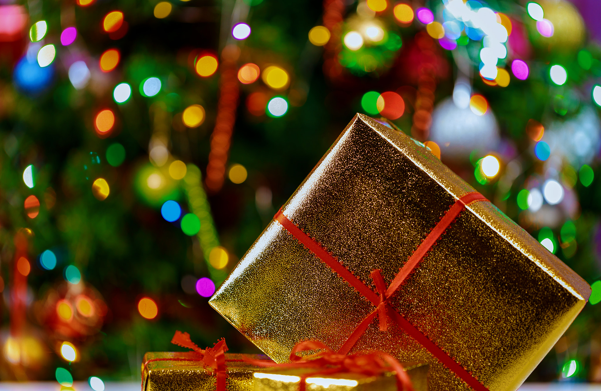 Detail of a nicely christmas present and christmas lights on a gift boxes selective focus