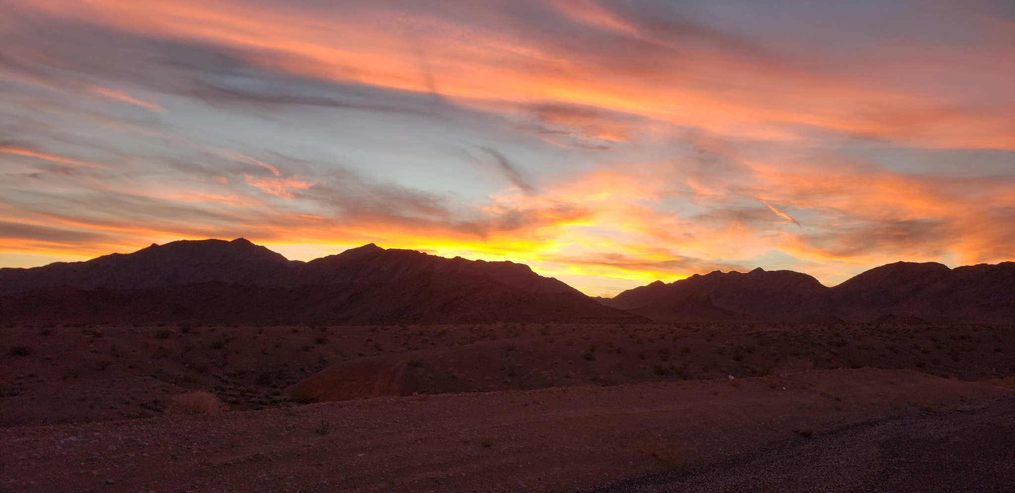 Sunset over sunrise mountains