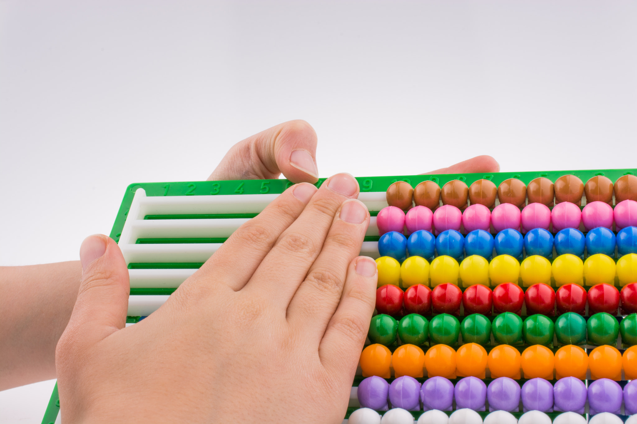 Hand using an abacus