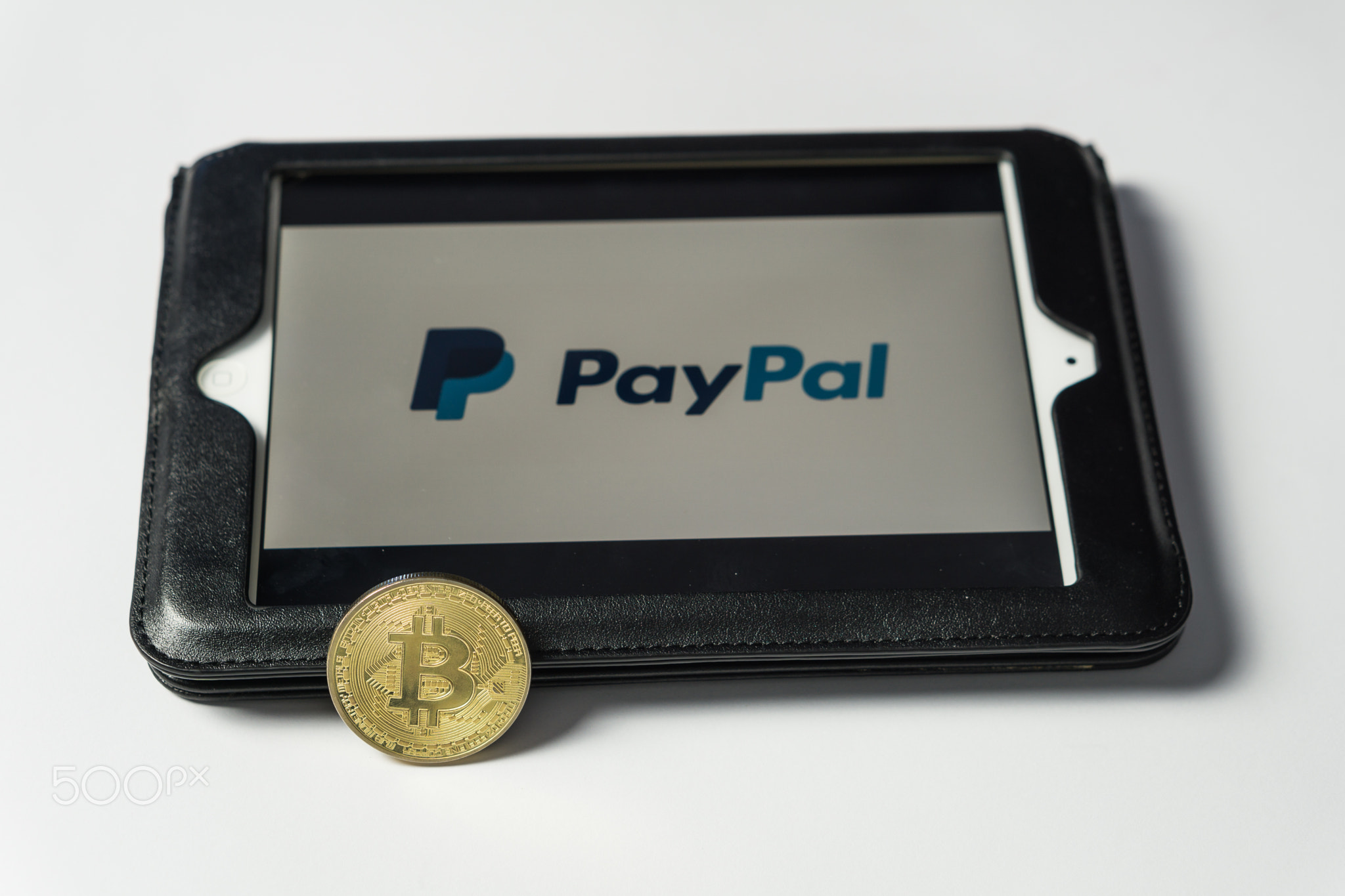 Bitcoin coin with the Paypal logo on a laptop screen, Slovenia - December 23th, 2018