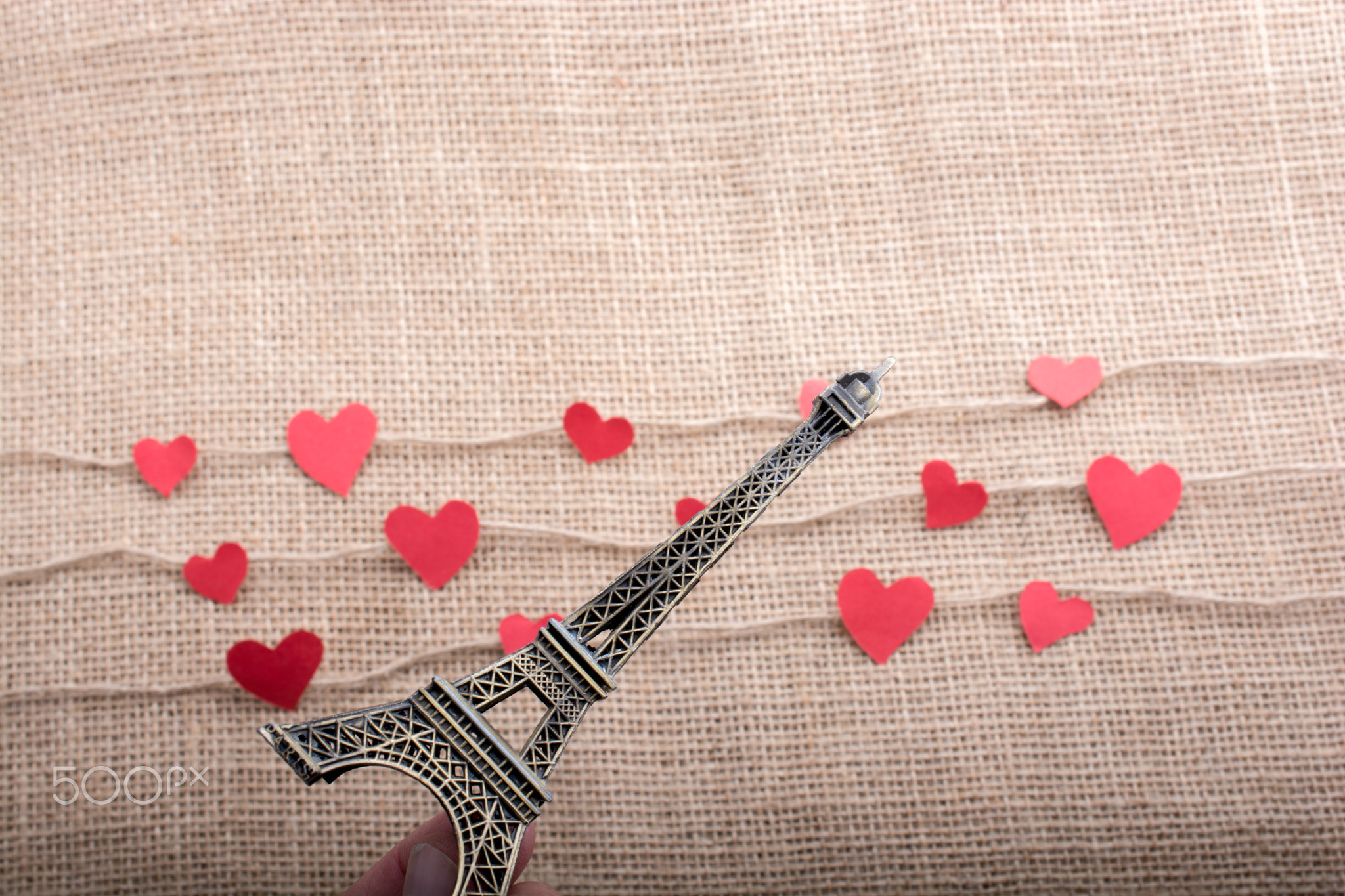 Love concept with Eiffel tower and heart shaped icons