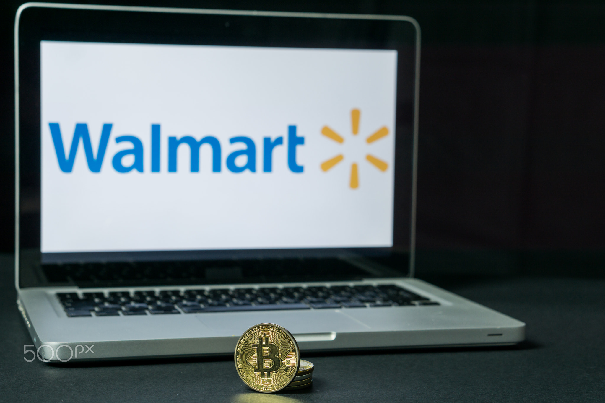 Bitcoin coin with the Walmart logo on a laptop screen, Slovenia - December 23th, 2018