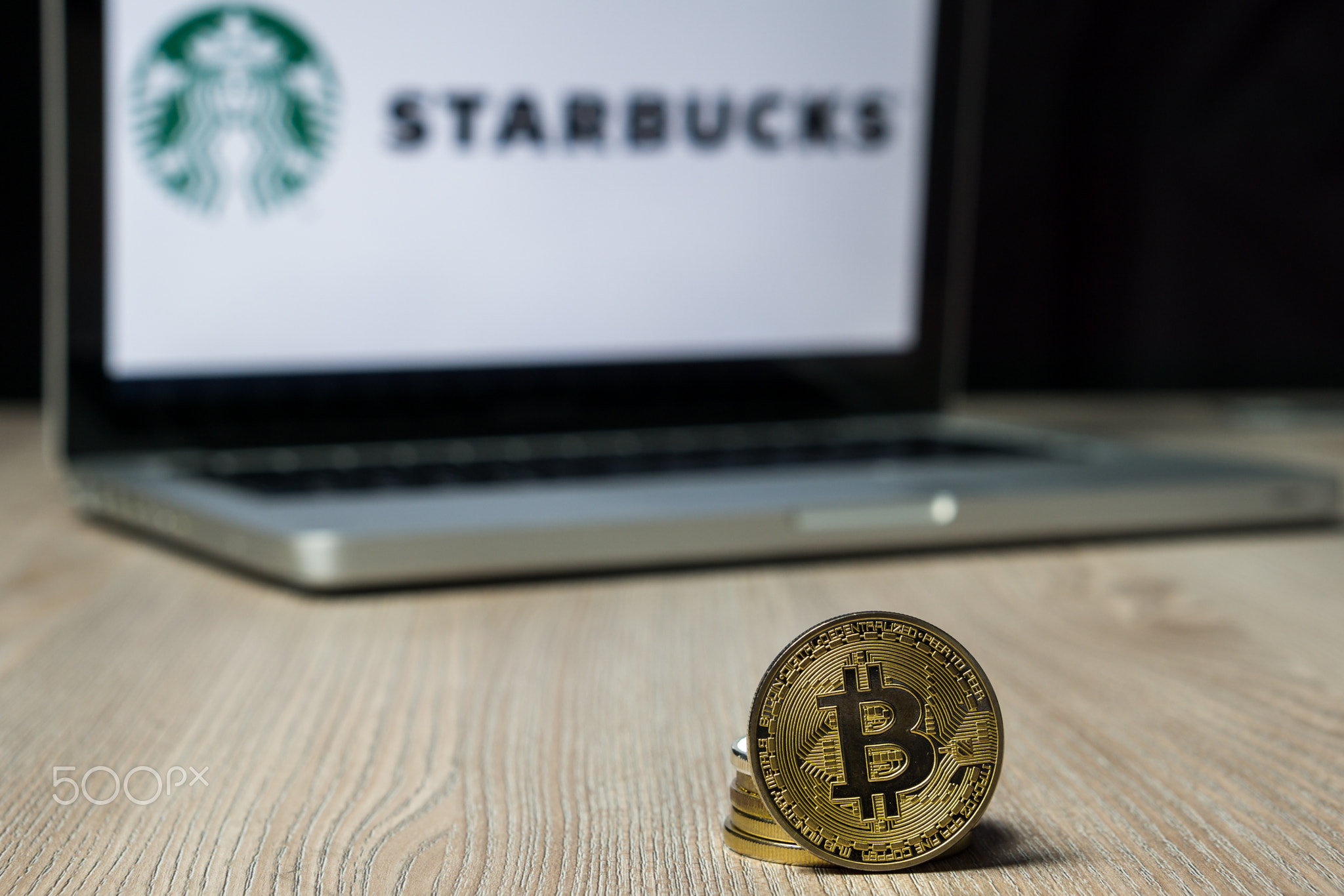 Bitcoin coin with the Starbucks logo on a laptop screen, Slovenia - December 23th, 2018