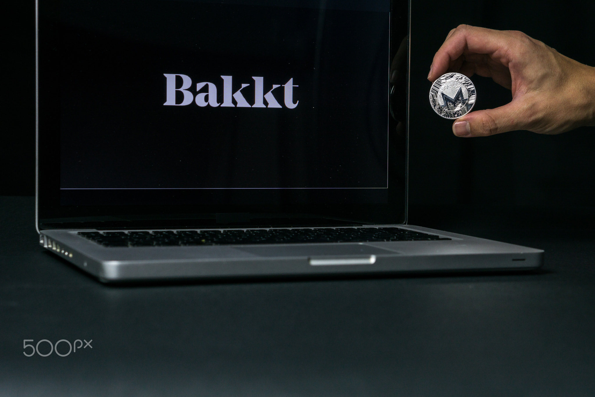 Monero coin with the Bakkt logo on a laptop screen, Slovenia - December 23th, 2018