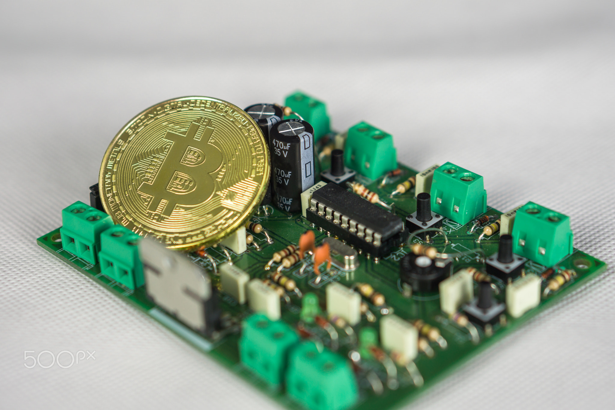 Photo of Bitcoin or Bitcoin cash on electronic circuit, computer part