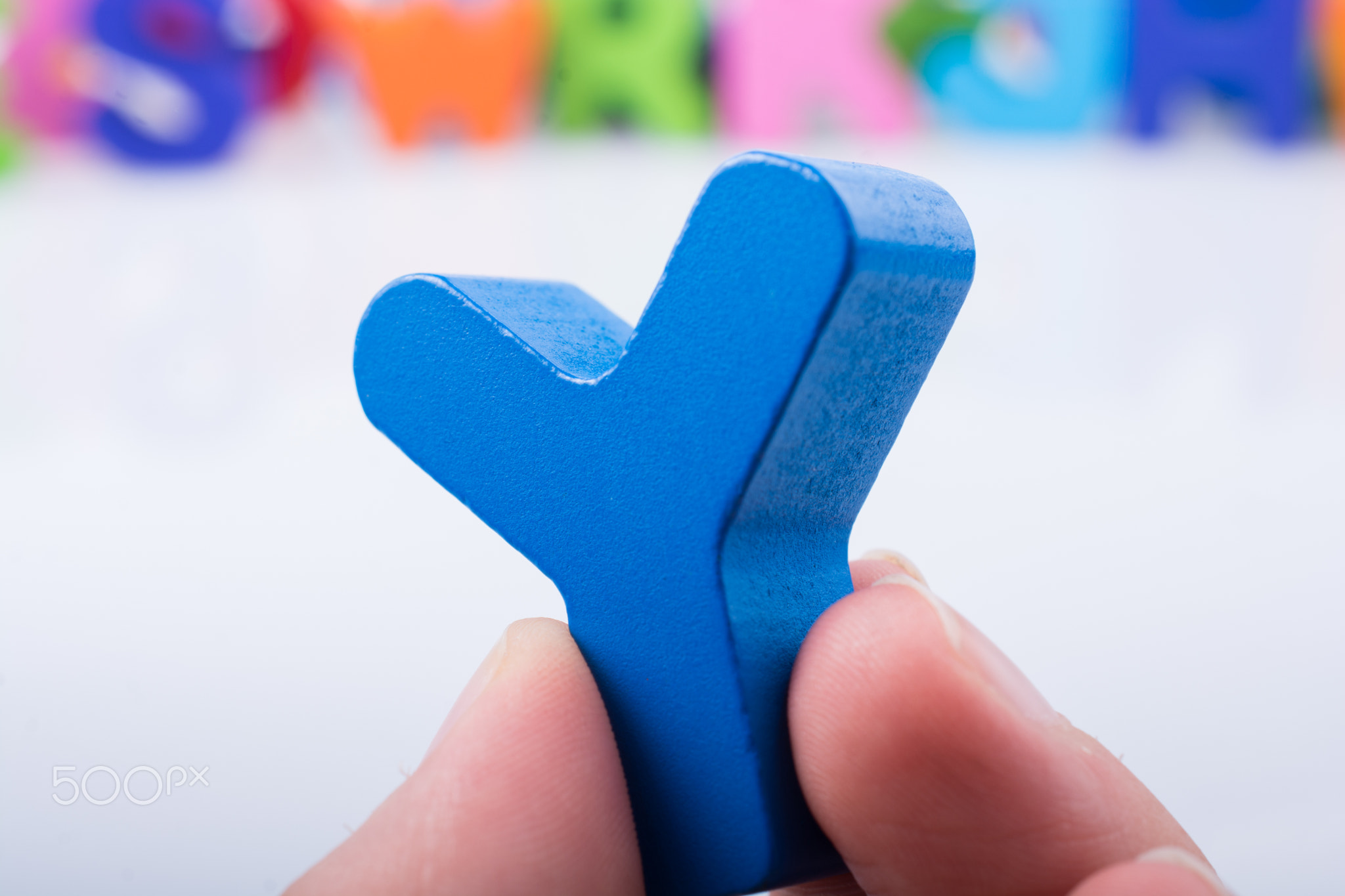 Hand holding Letter cube  Y of  Alphabet