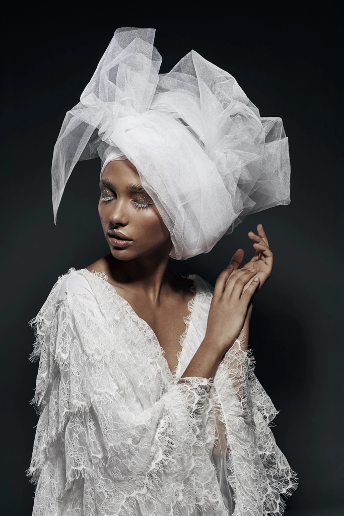 Fashion portrait of woman with white make up, in white lace dress with white veil head tie and... by Jaroslav Monchak on 500px.com