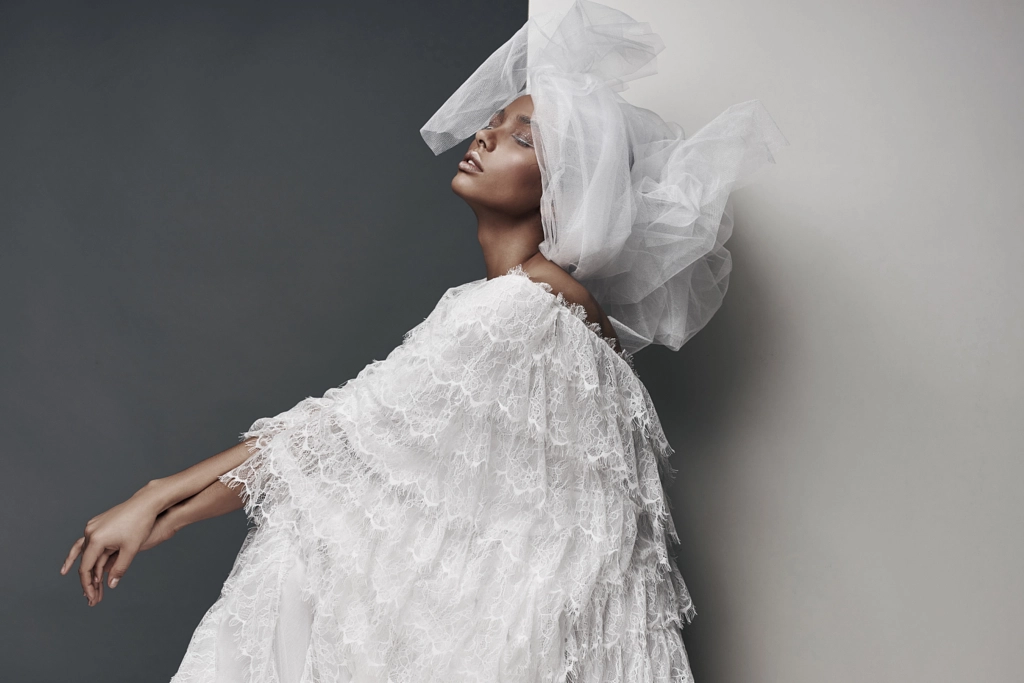 Studio portrait of woman with white make up, in white lace dress, white veil head tie and big... by Jaroslav Monchak on 500px.com