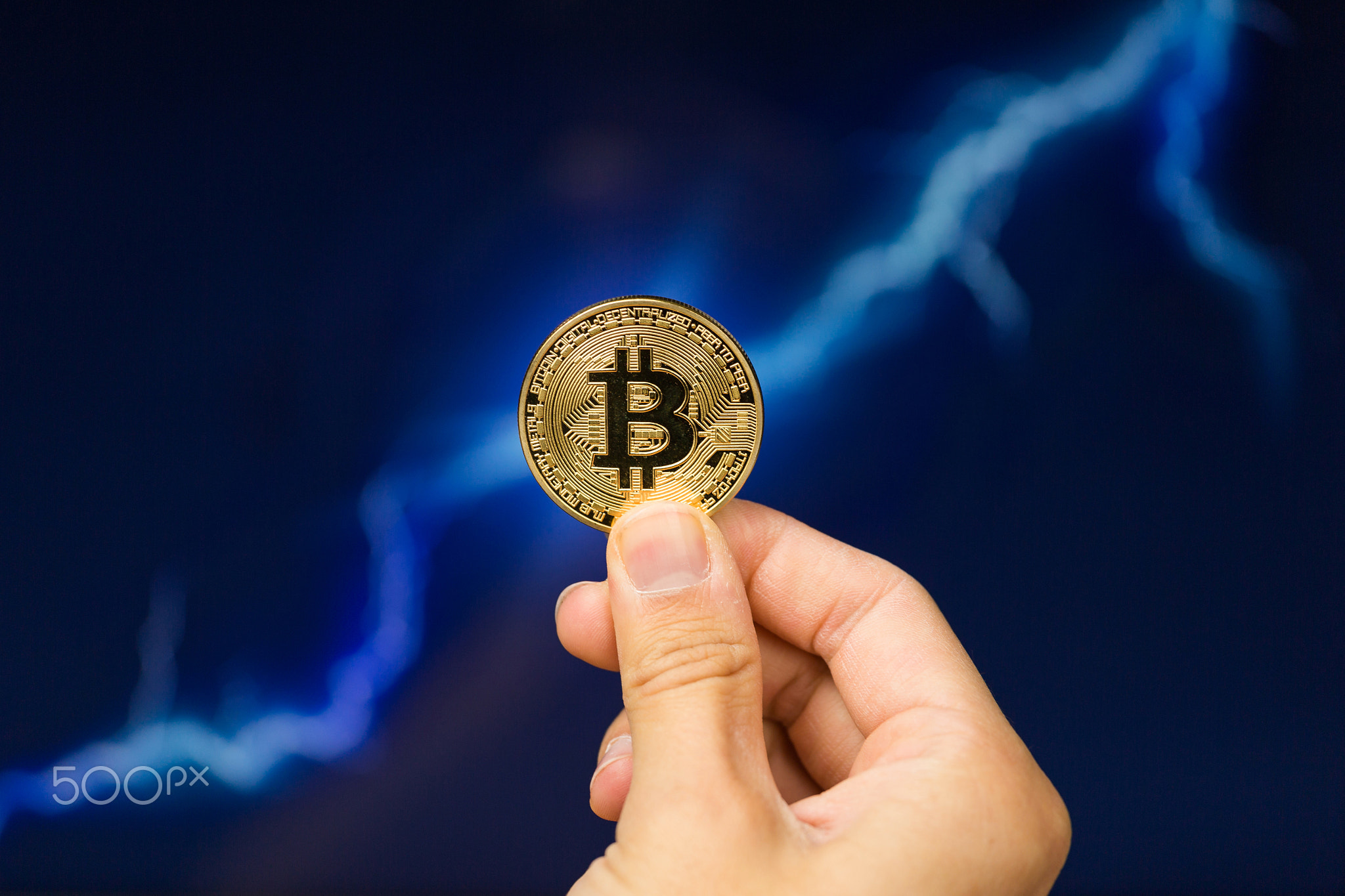 Bitcoin coin in front of lightning