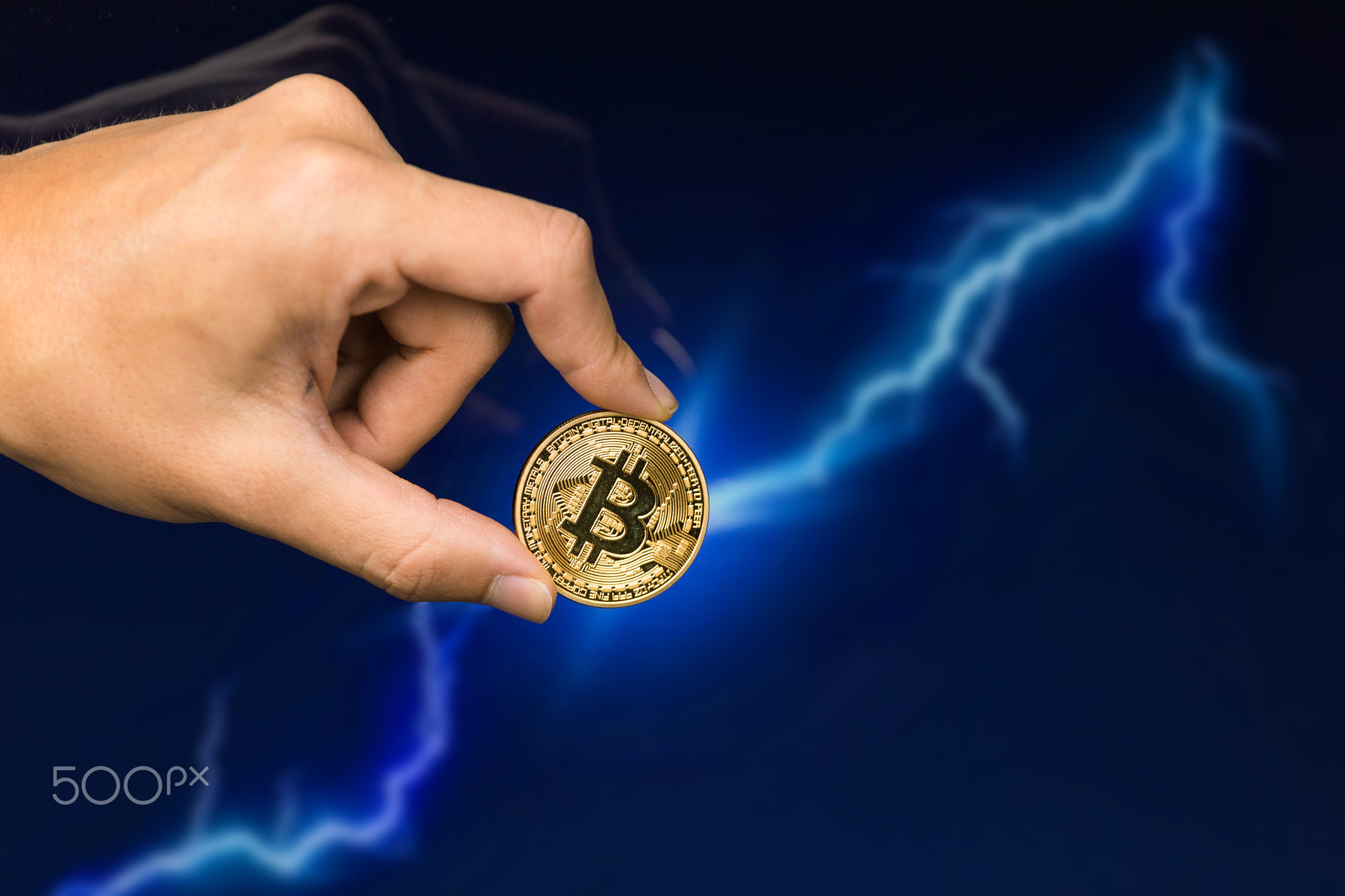 Bitcoin coin in front of lightning