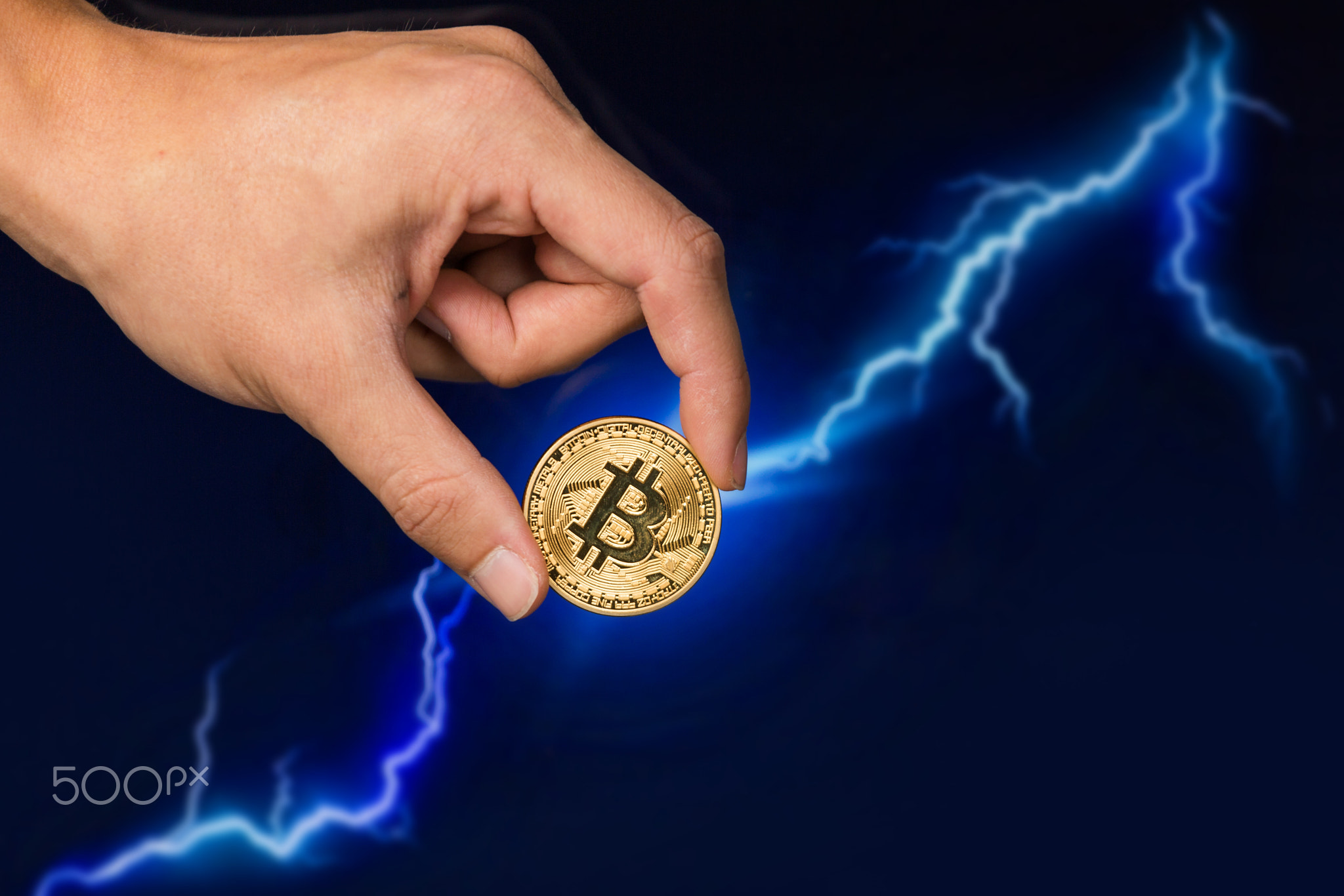 Bitcoin coin in front of lightning