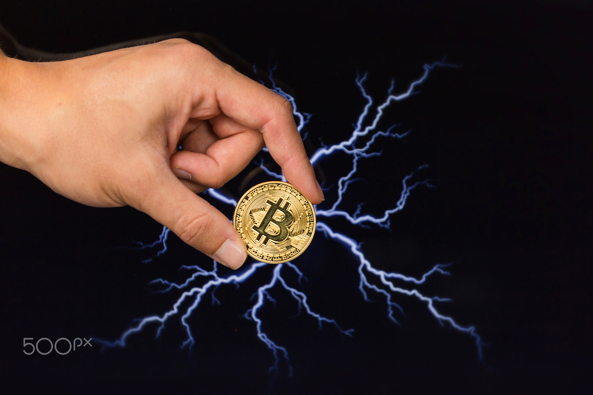 Bitcoin coin in front of lightning