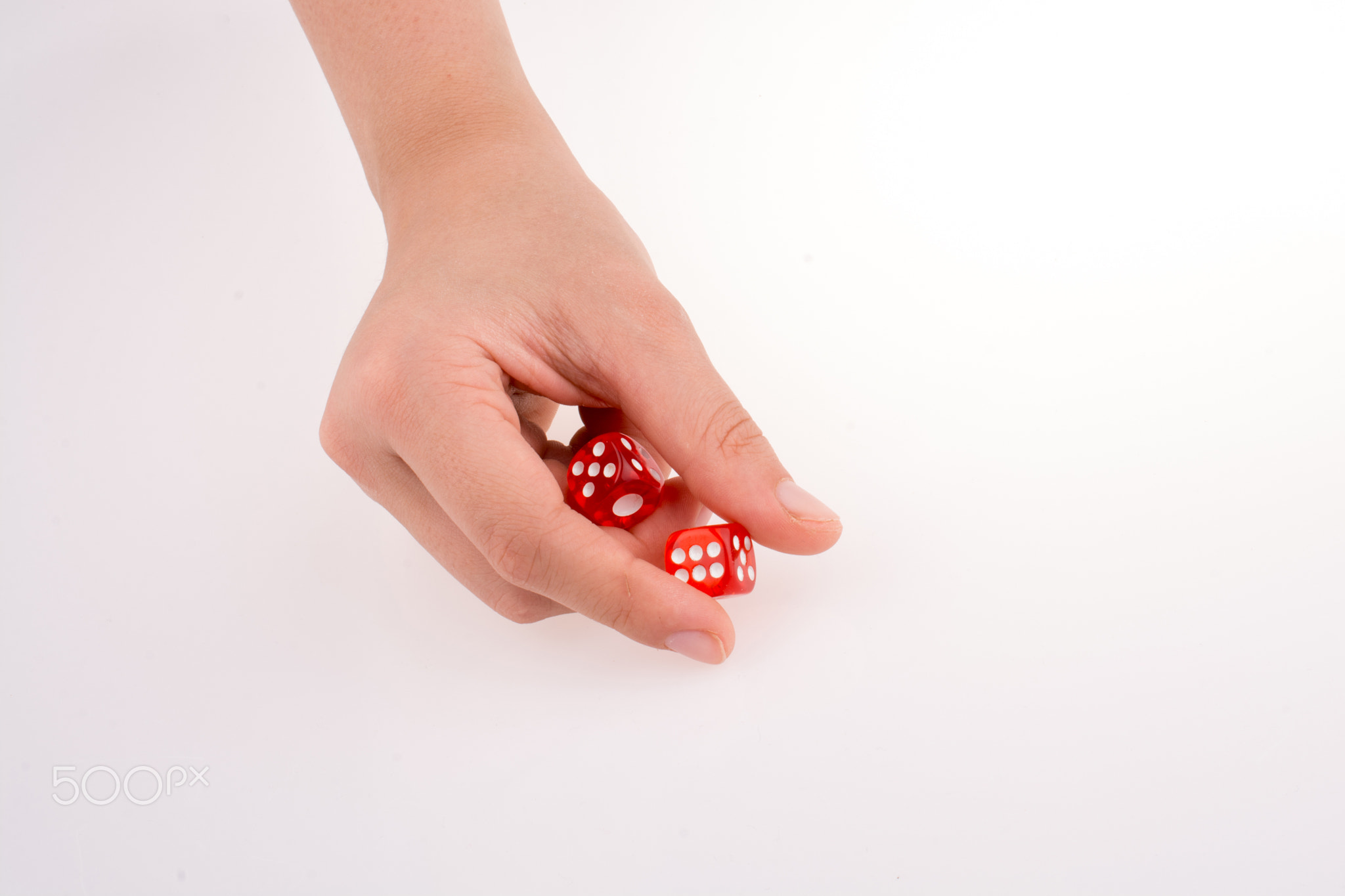 Hand holding red dice