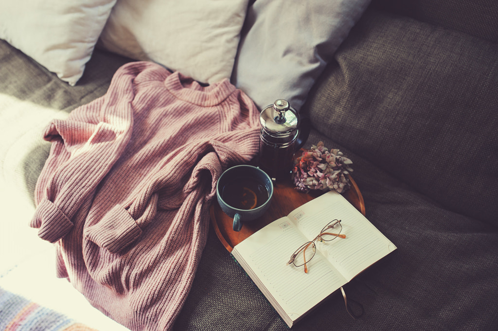 country house living room interior details. Cozy couch, hot tea and decorative pillows by Maria Kovalevskaya on 500px.com