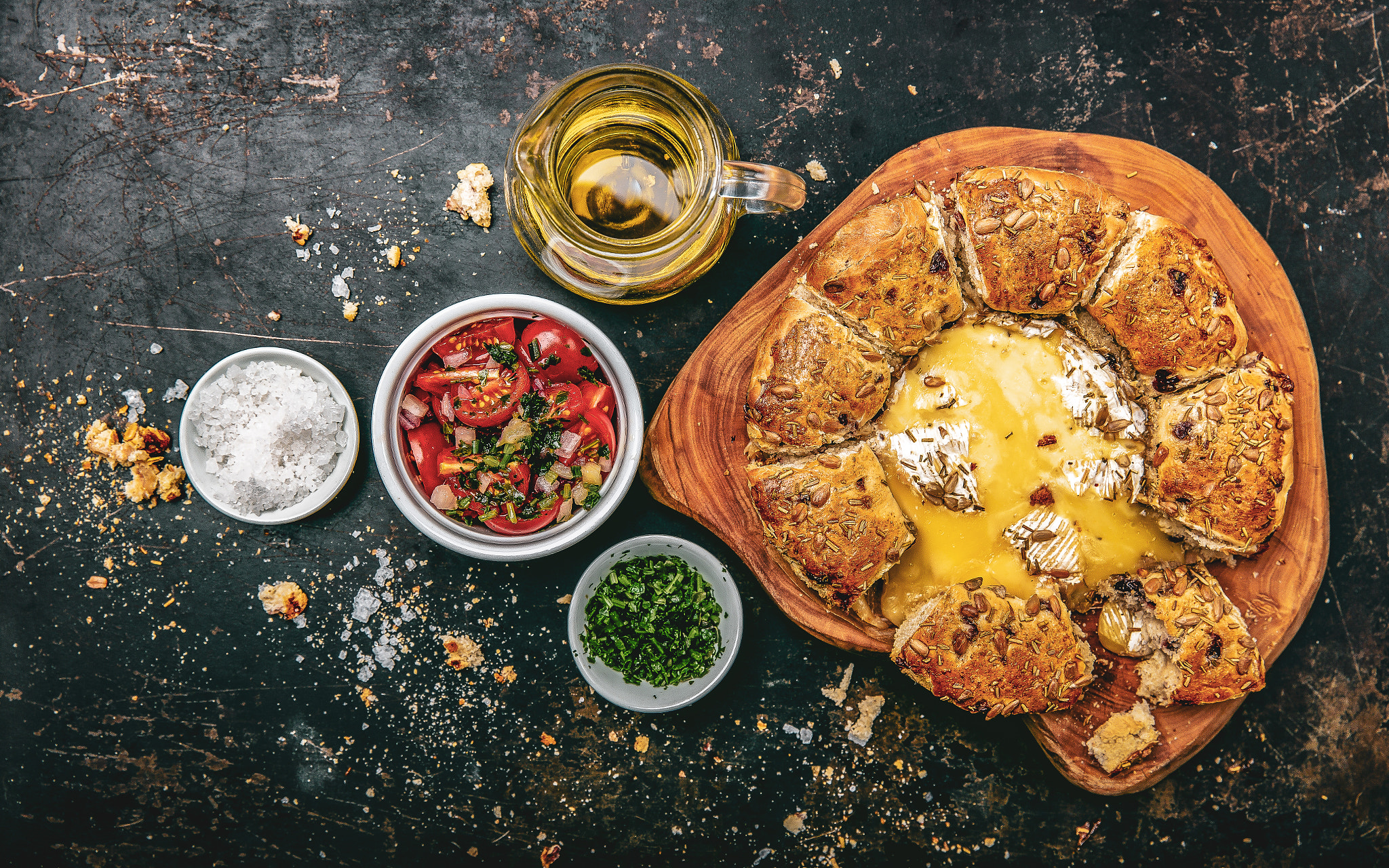 Camembert baked in the oven with herb bread served with tomato s