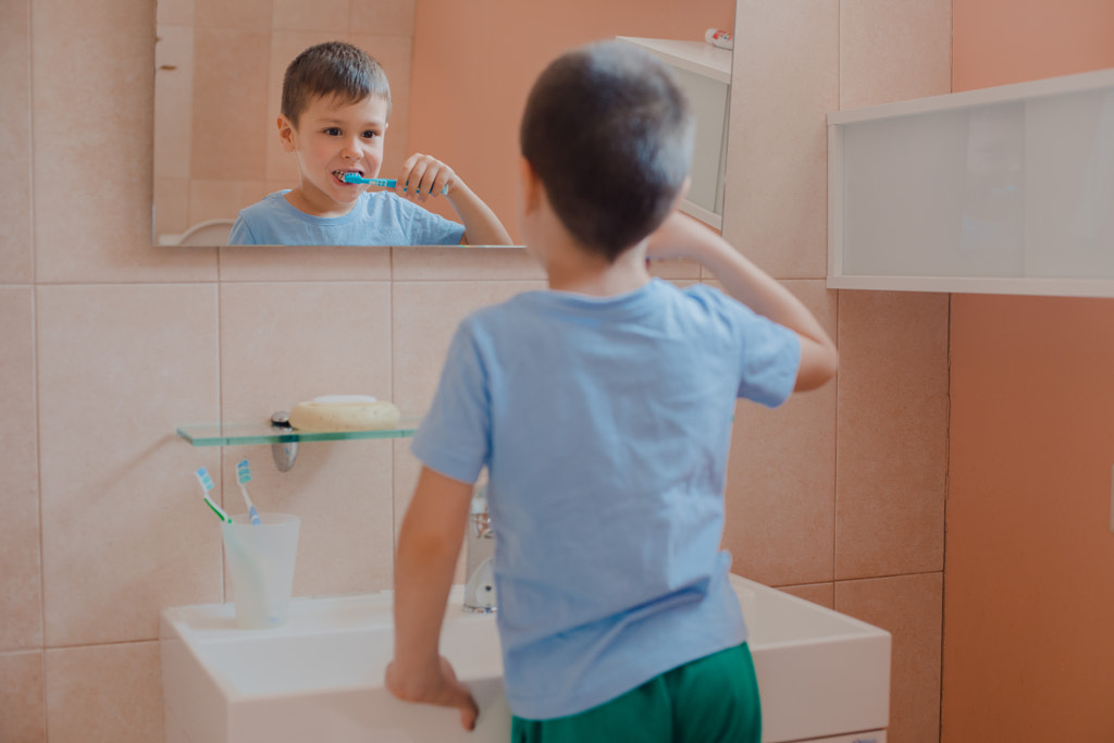 Happy kid or child brushing teeth in bathroom. by Yuliya  Shangarey Shangarey on 500px.com